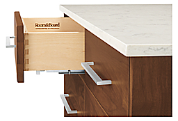 Detail of Booker 48-wide Four-Drawer Kitchen Island with Full Shelf.