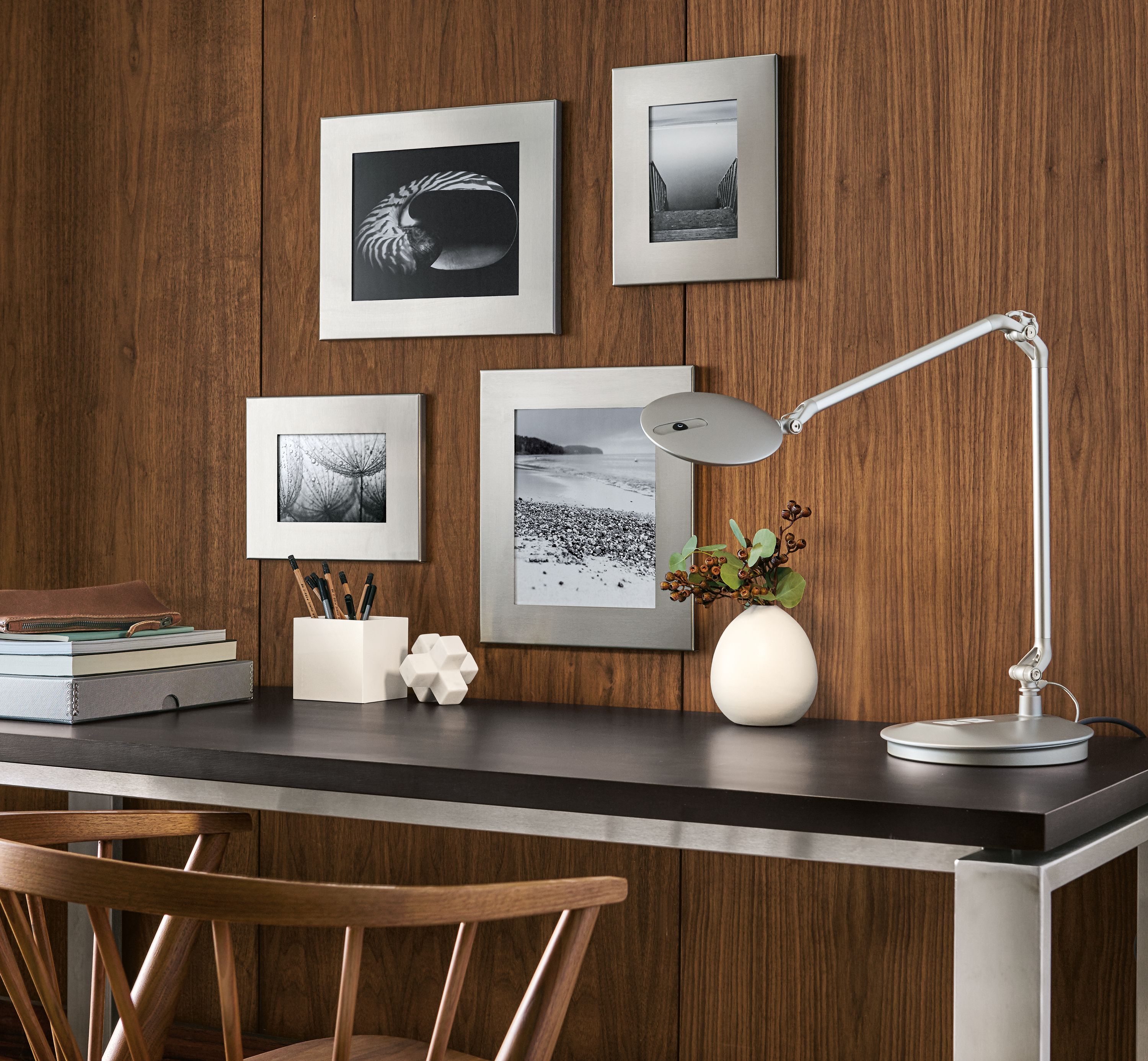 Detail of Borough, Manhattan and Bend picture frame wall in Stainless Steel.