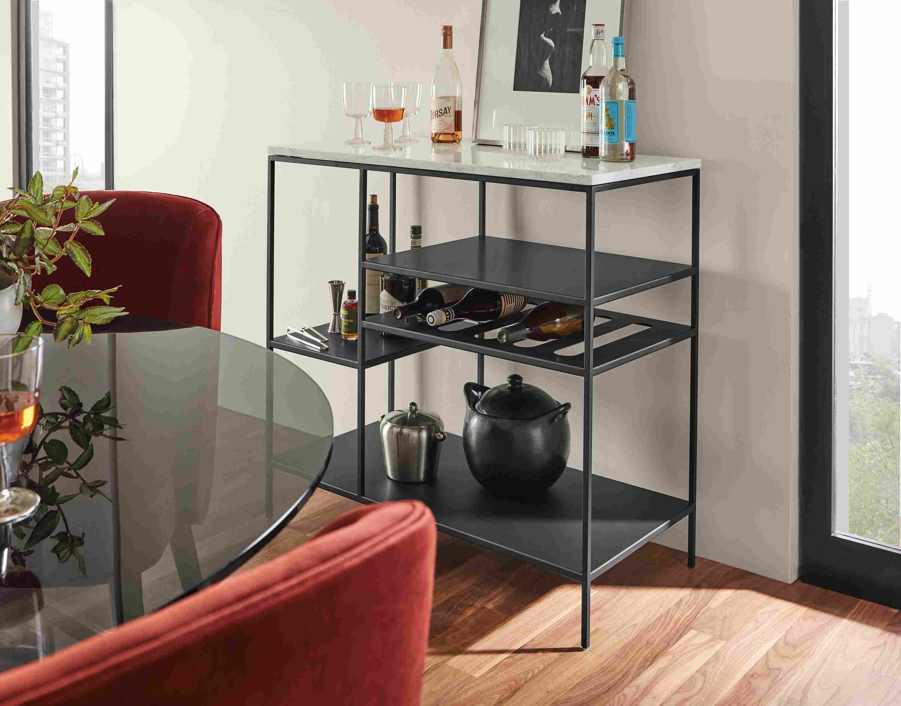 Close up of Bowen 36 by 18 by36 high Counter Table with Wine Shelf in Graphite with Marbled White Quartz Top in dining area.