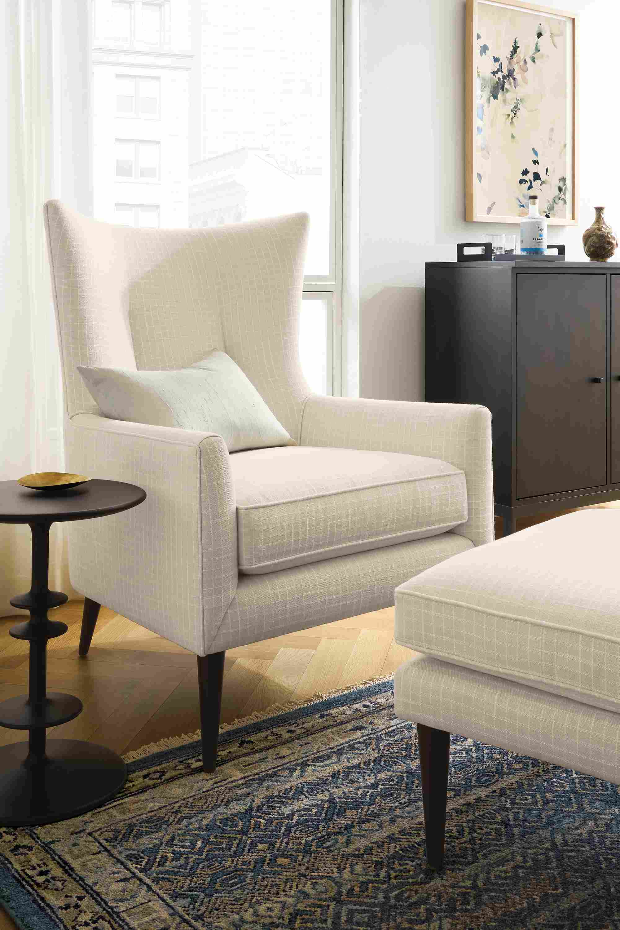 Living room with bradford chair and ottoman in prado natural and anza 8 by 10 rug in marine.