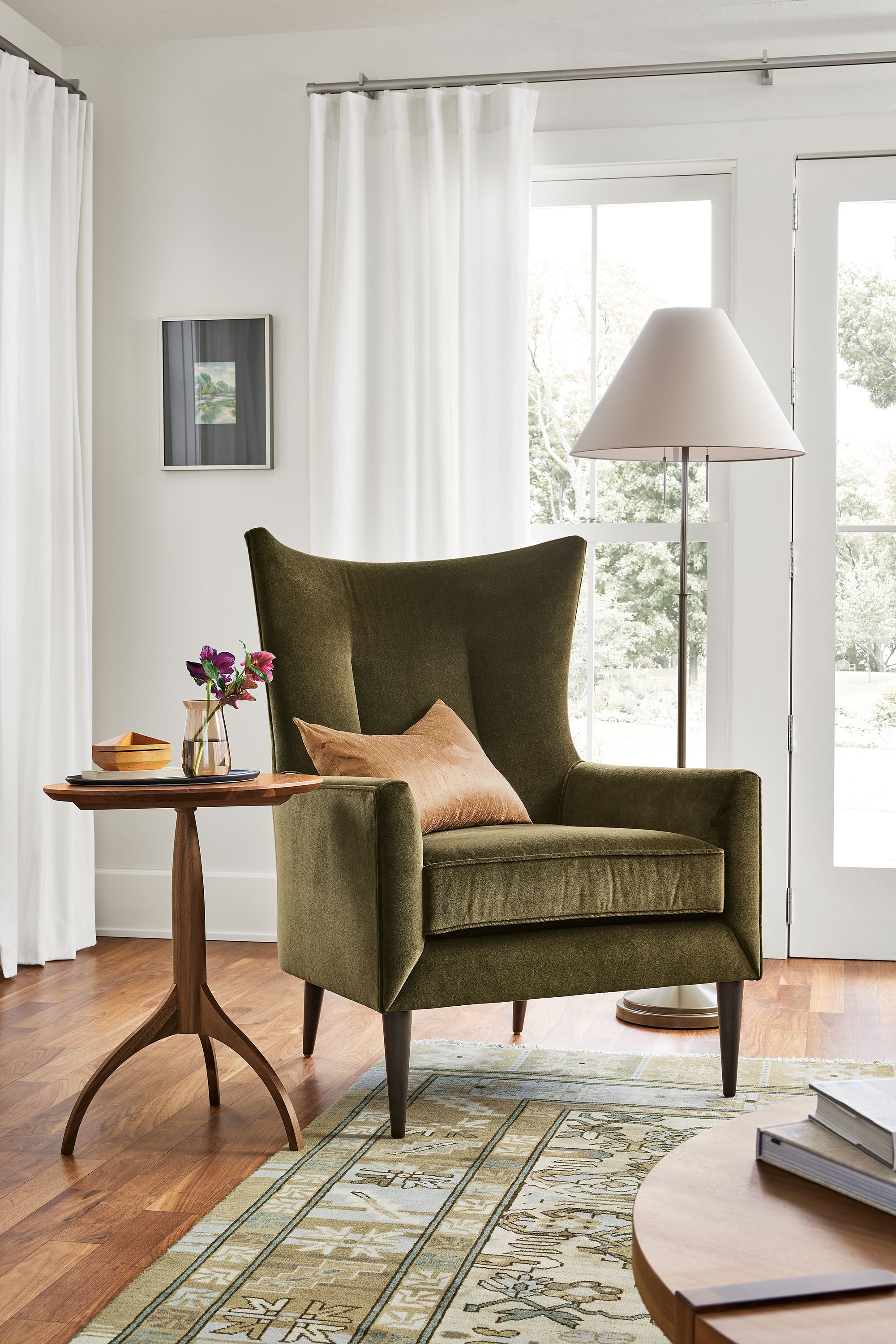 Living room with bradford chair in vance olive and adams table in walnut.