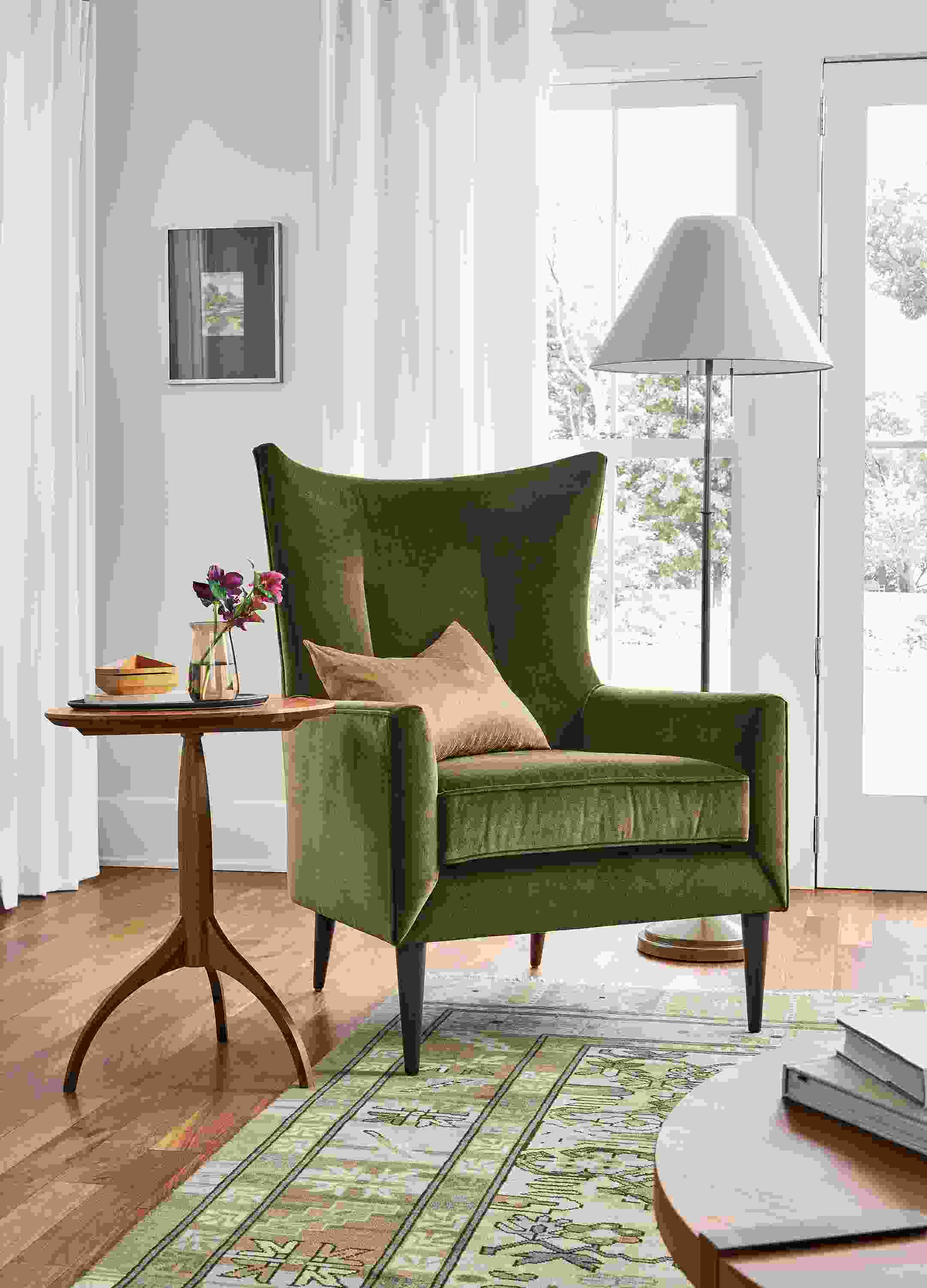 Living room with bradford chair in Redding Olive and adams table in walnut.