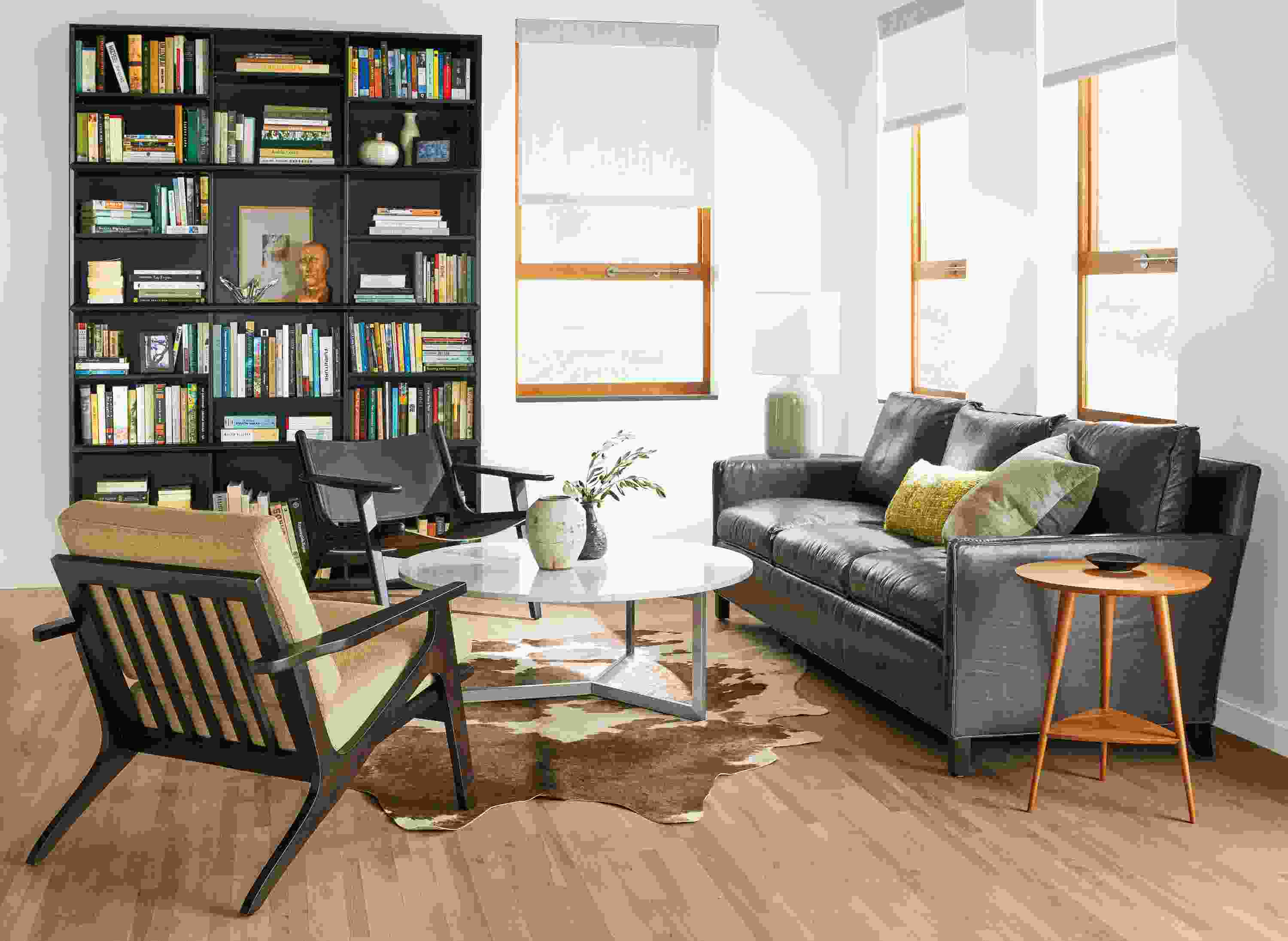 Modern living room with leather and fabric sofa and chairs.