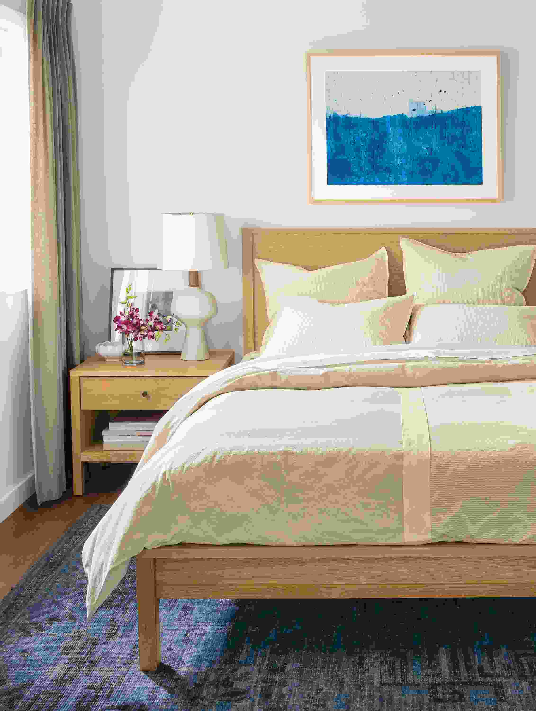 Detail of Brandt duvet cover on queen white oak bed.