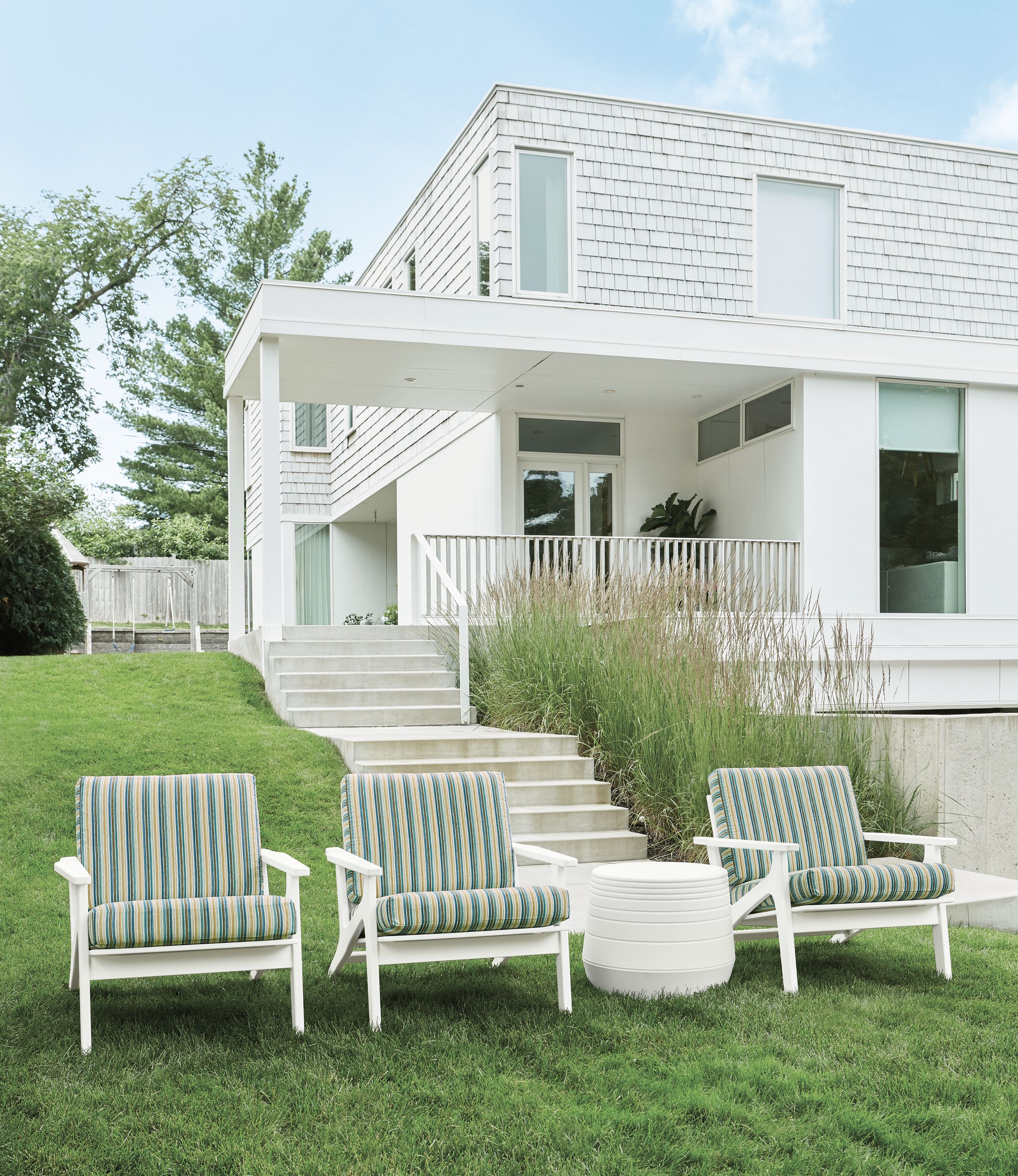Detail of 3 Breeze chairs in Vinna fabric on lawn.