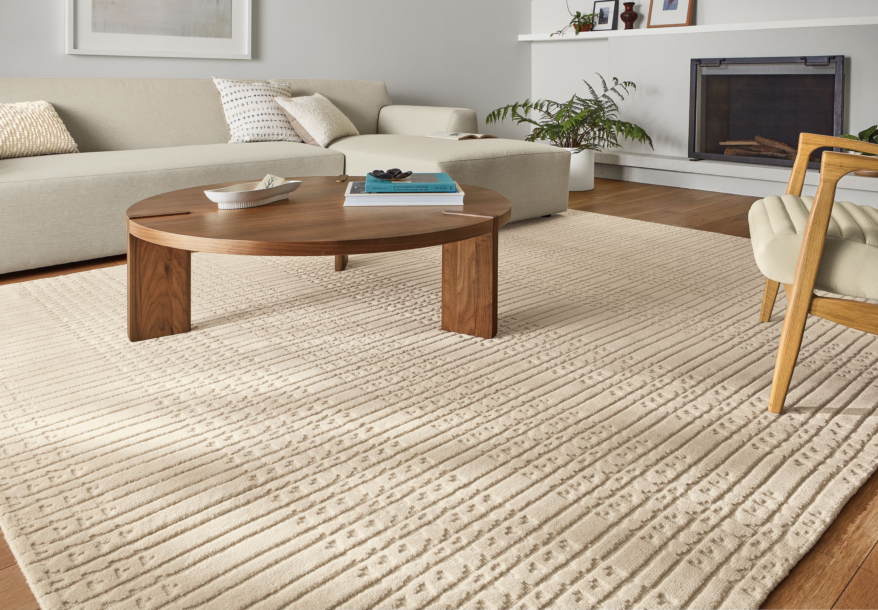 Living room with Bria 8x10 rug and Hanover walnut coffee table.