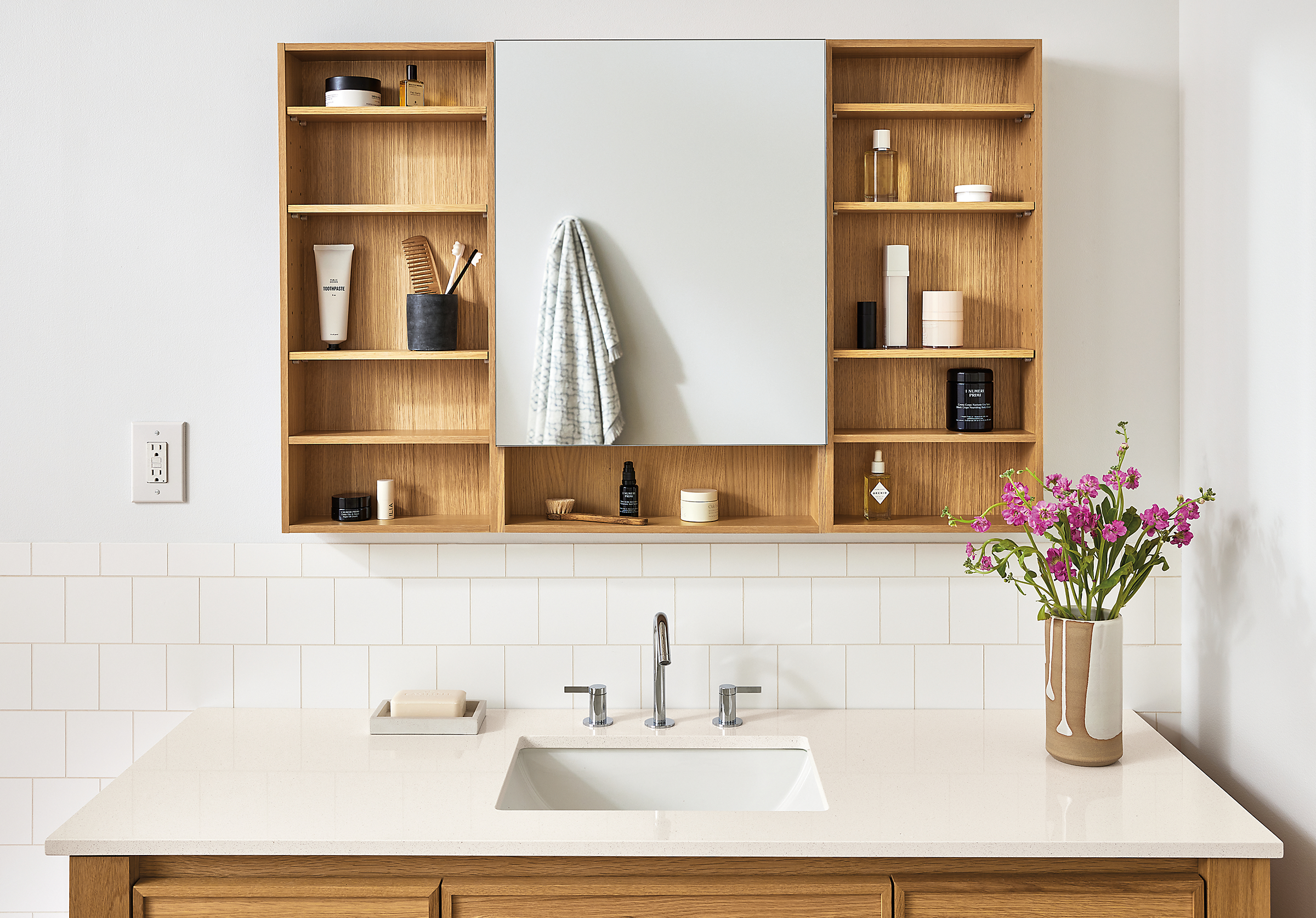 Bathroom with Bridger 46.5 wide medicine cabinet in white oak and Amherst 60-wide vanity in white oak.