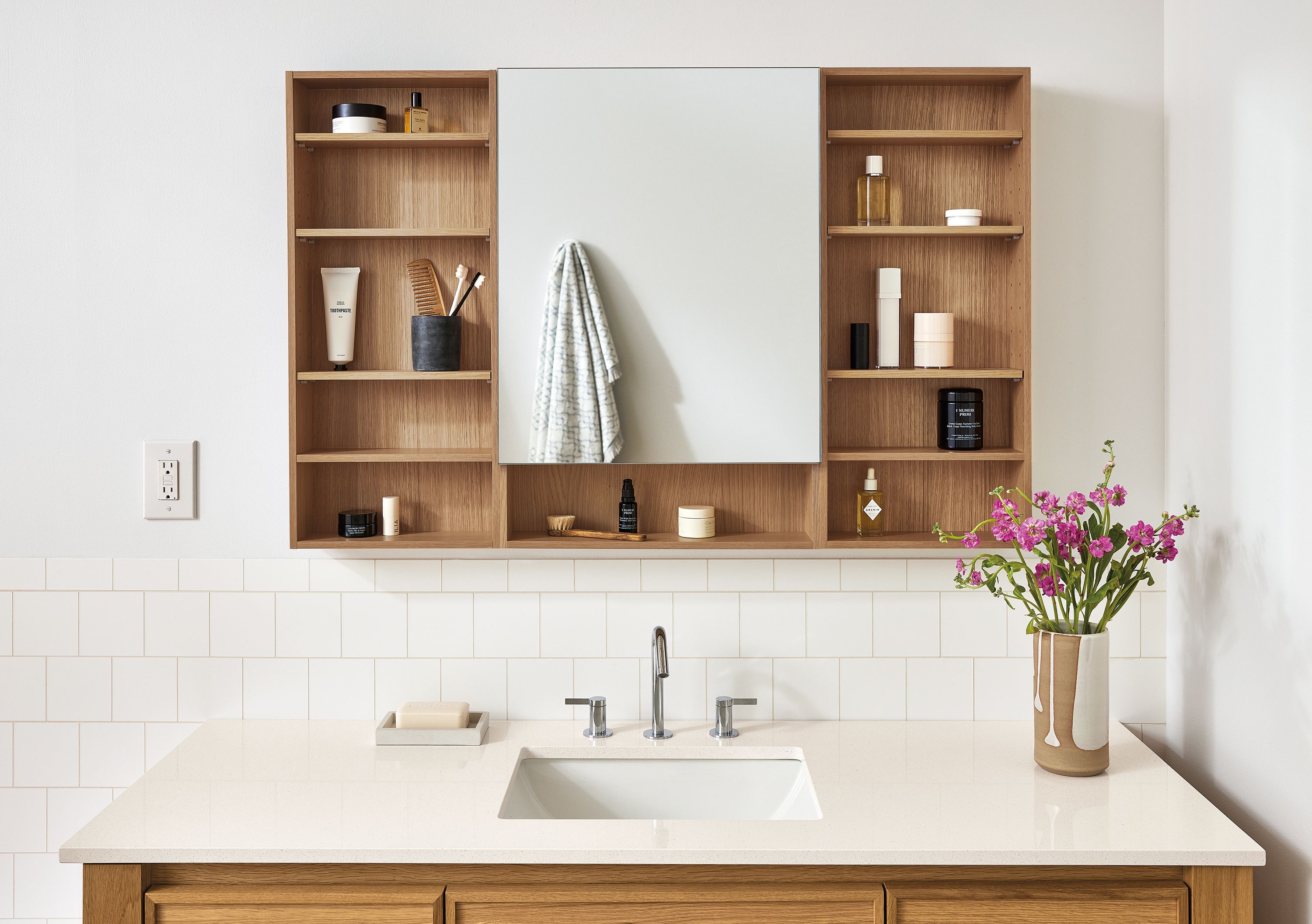 Bathroom with Bridger 46.5 wide medicine cabinet in rye on red oak and Amherst 60-wide vanity in white oak with white quartz top.