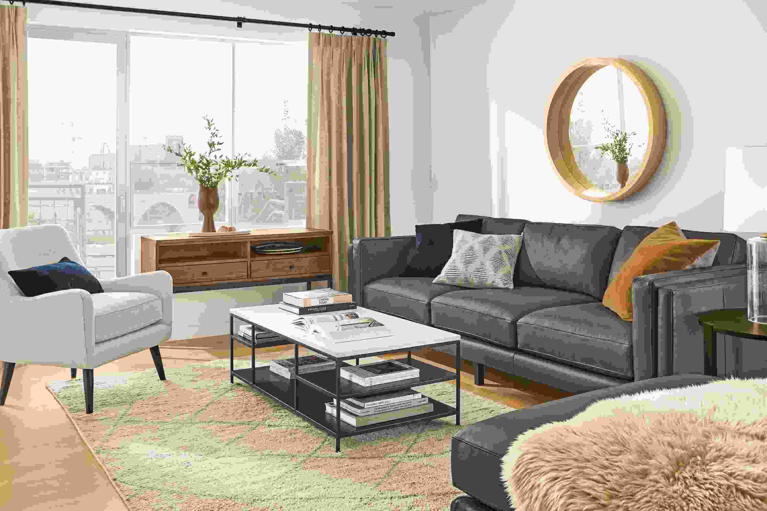 Detail of Cade sofa in Urbino smoke leather in living room setting.