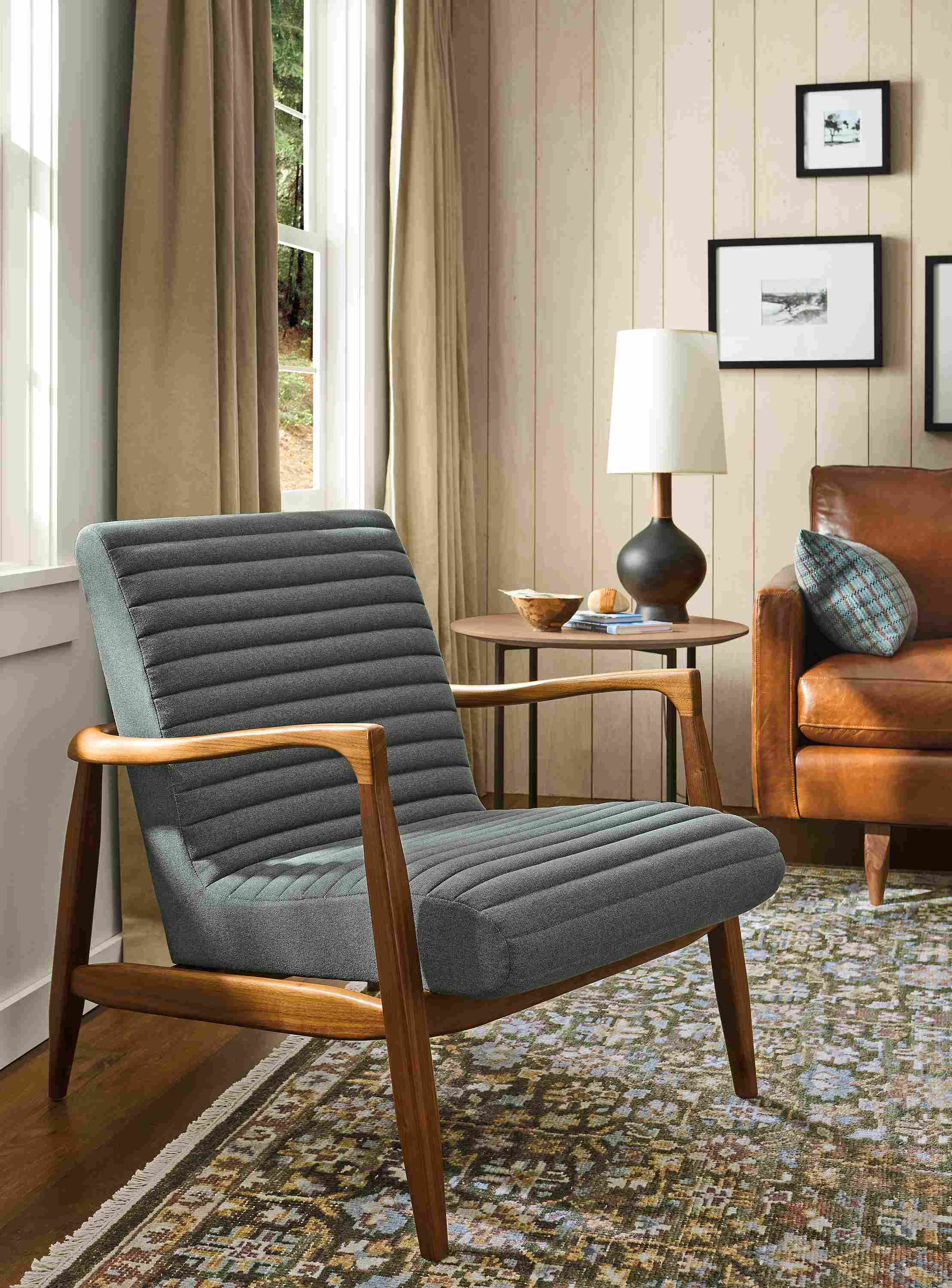 Living room with Callan chair in Myers Pine, Jasper sofa in Vento Cognac and Rosalie rug in forest.