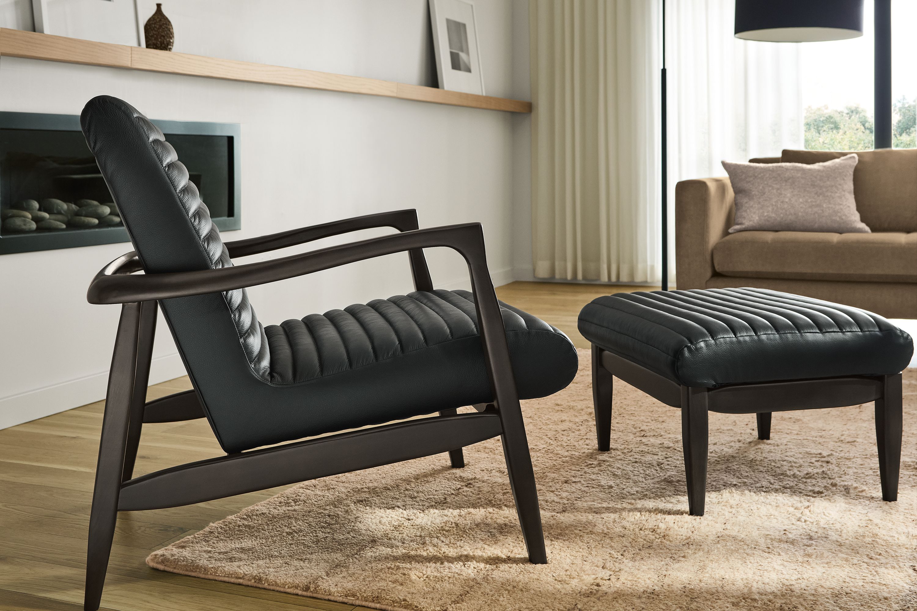 Chair & ottoman in Pesaro black leather and charcoal frame