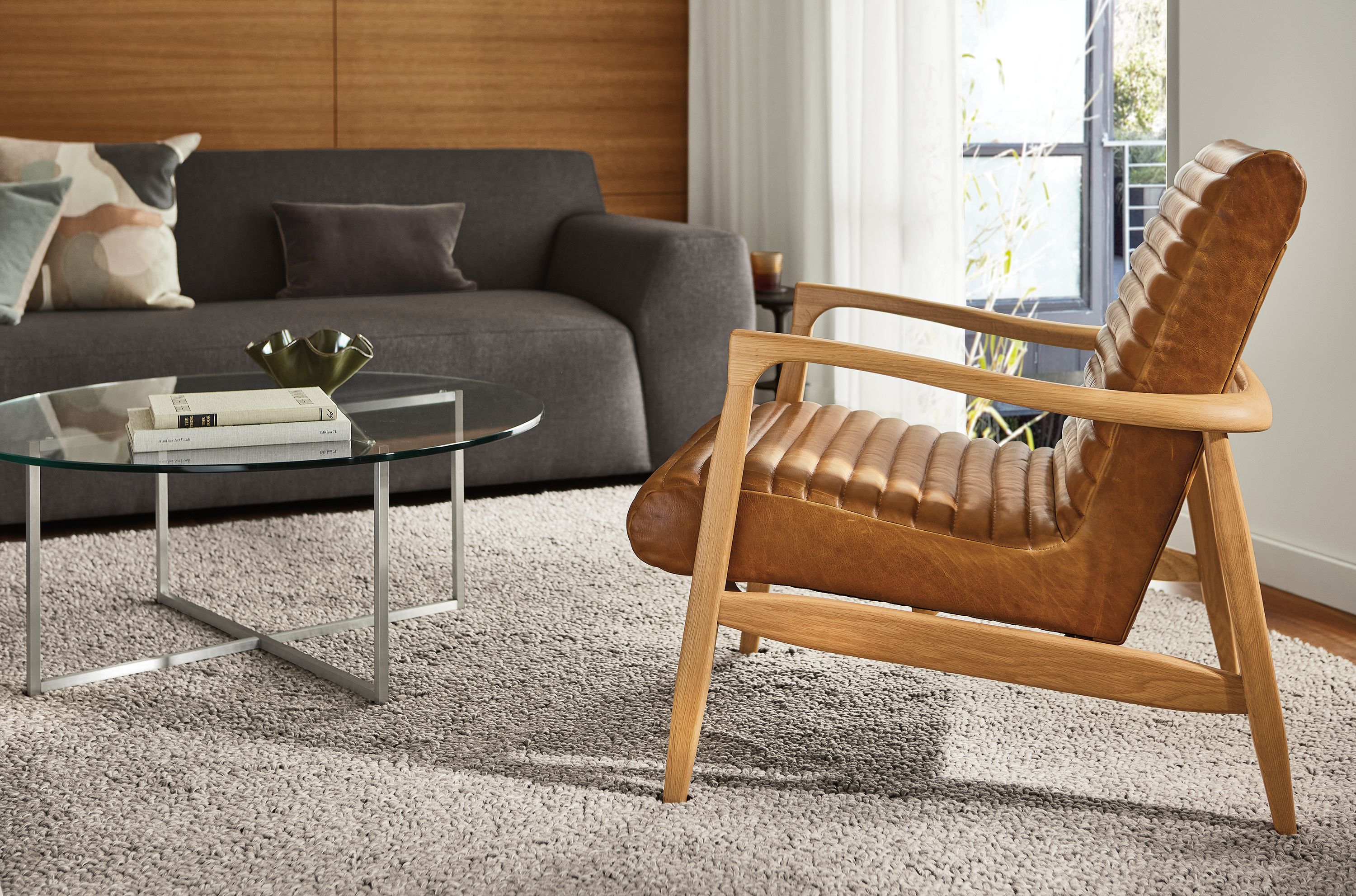 Living room area with Callan Chair in Cyrus Pecan, Arden rug in Fawn, Linville Sofa and Classic coffee table.