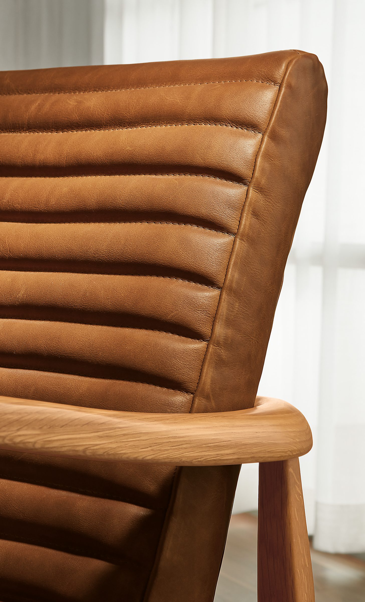Close detail of Callan Chair in Cyrus Pecan leather and White oak.