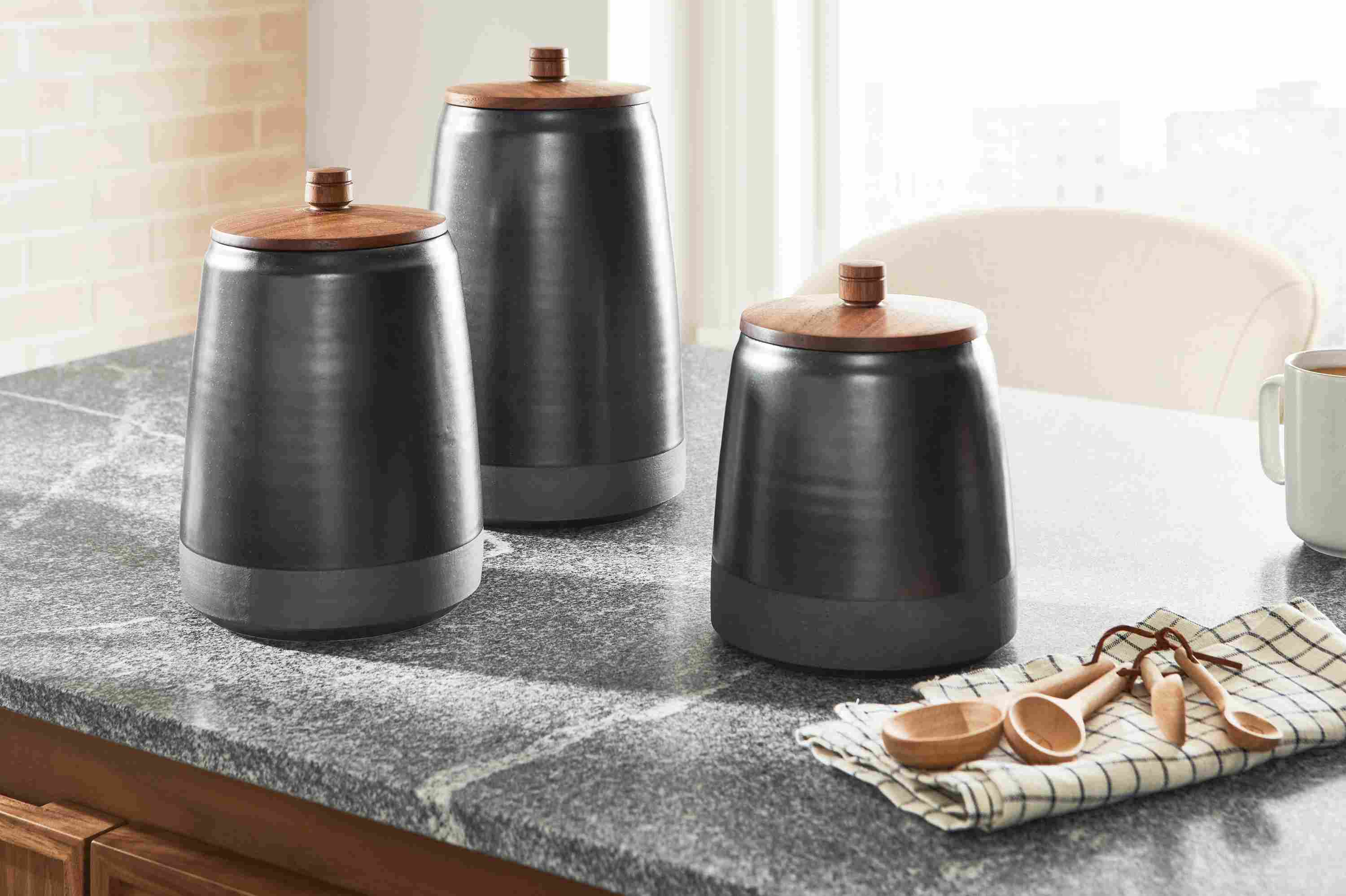3 Calumet canisters in black on an Amherst kitchen island.
