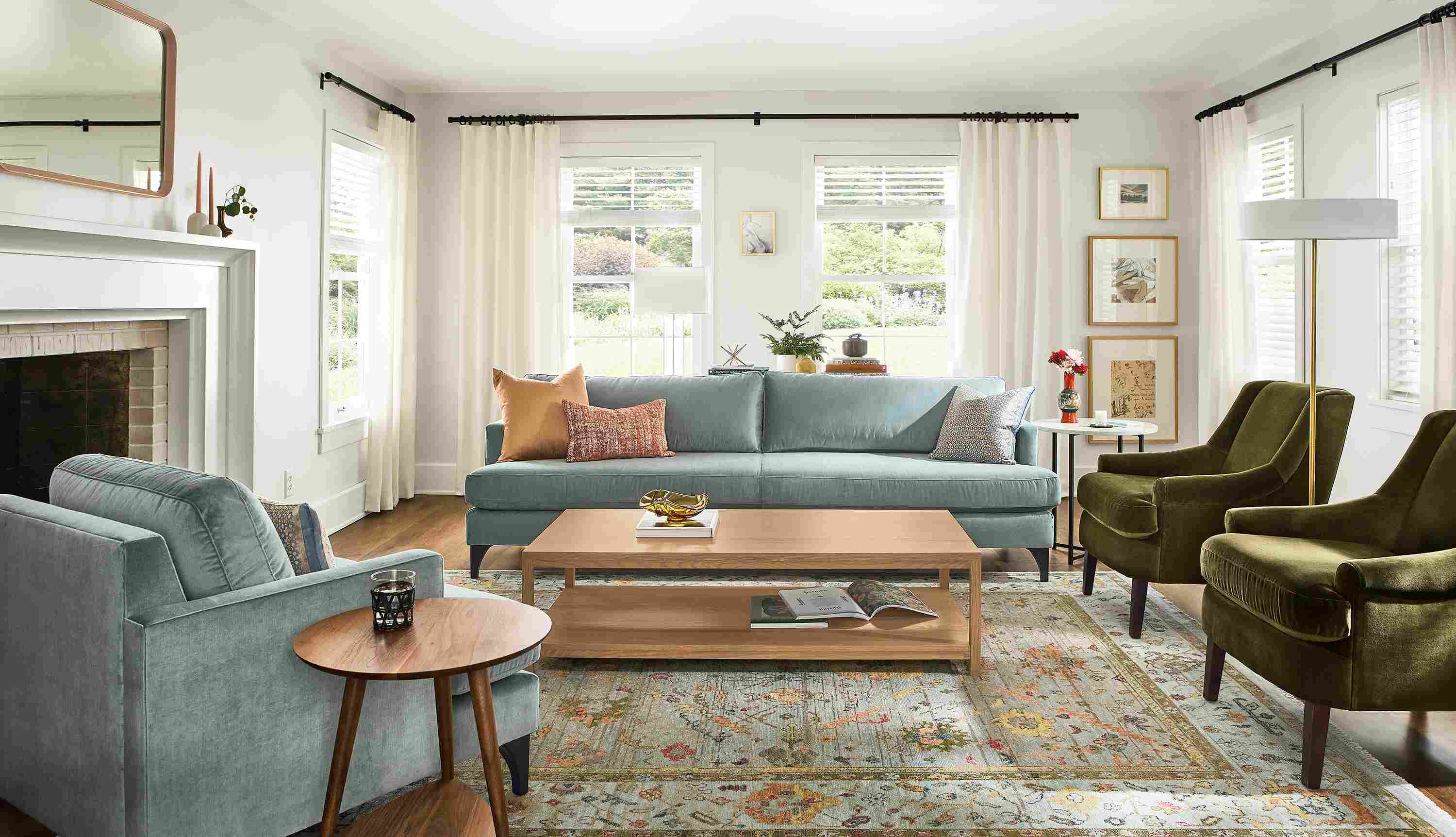 Living room with carlton bench-cushion sofa and carlton chair in windsor cloud and louise chair in vance olive.