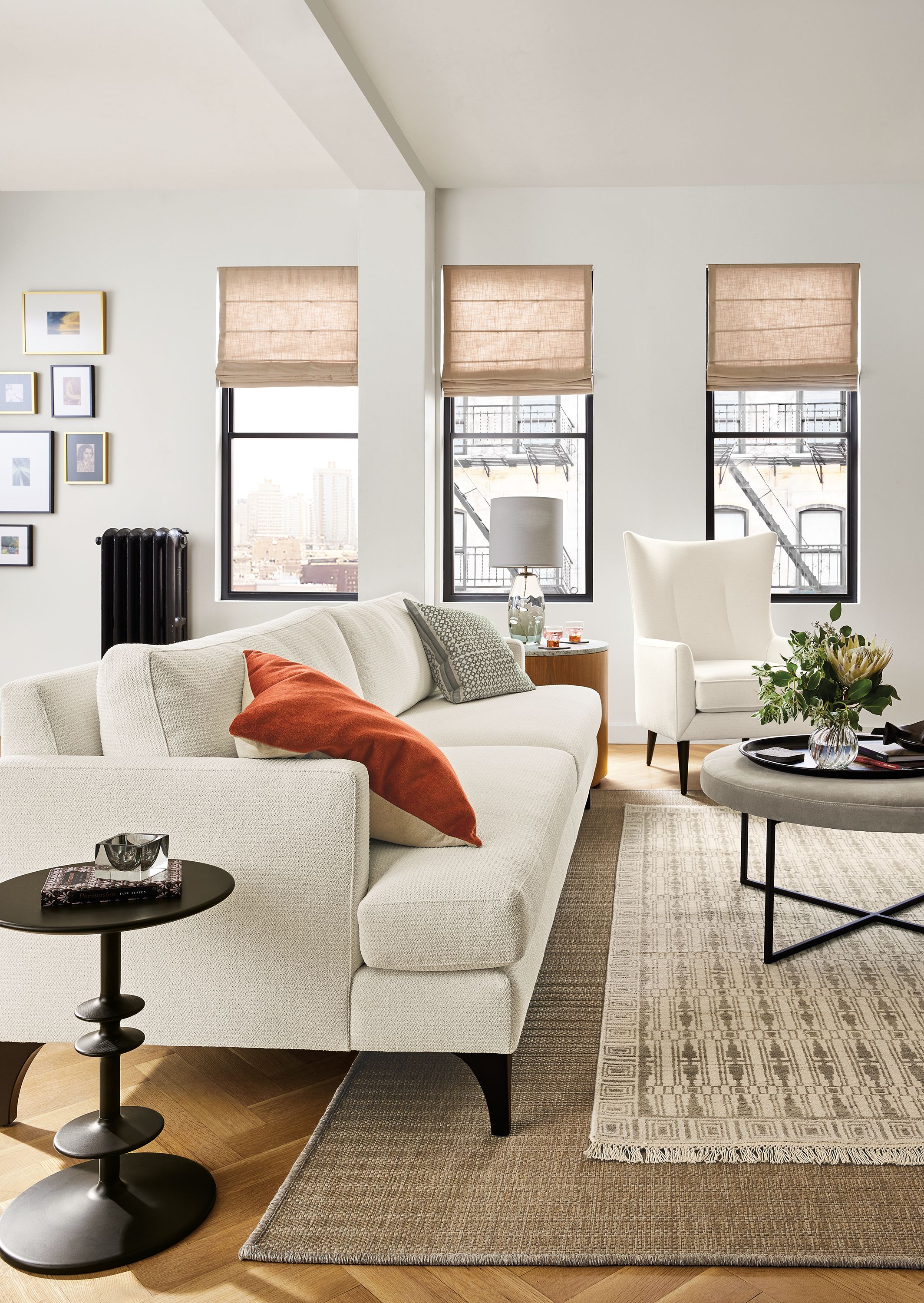 living room with carlton sofa in orla white fabric, brandford chair in white, and parks end table in charcoal.