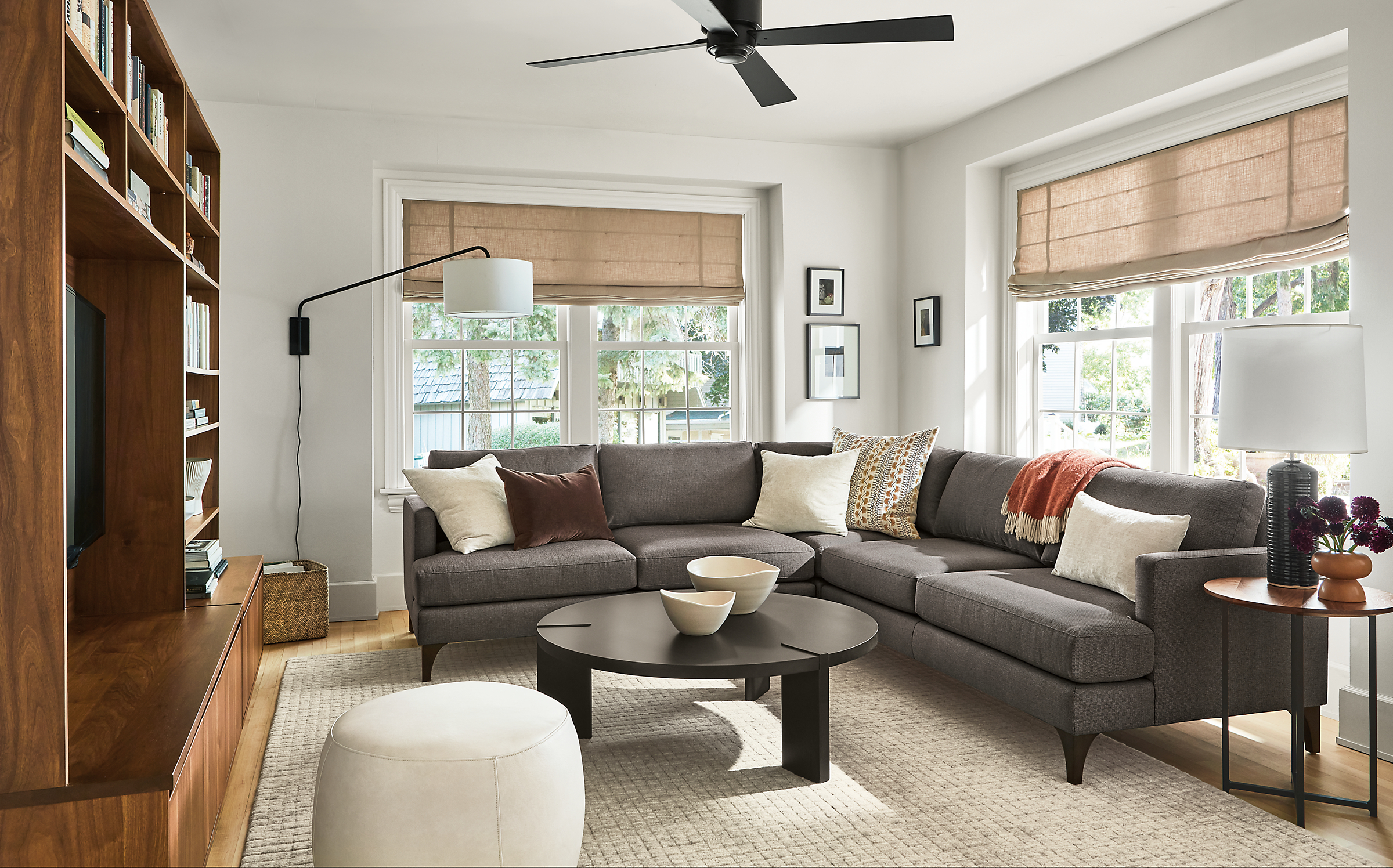 living room with carlton sectional in gino charcoal, hanover coffee table, classic end table and lind ottoman.
