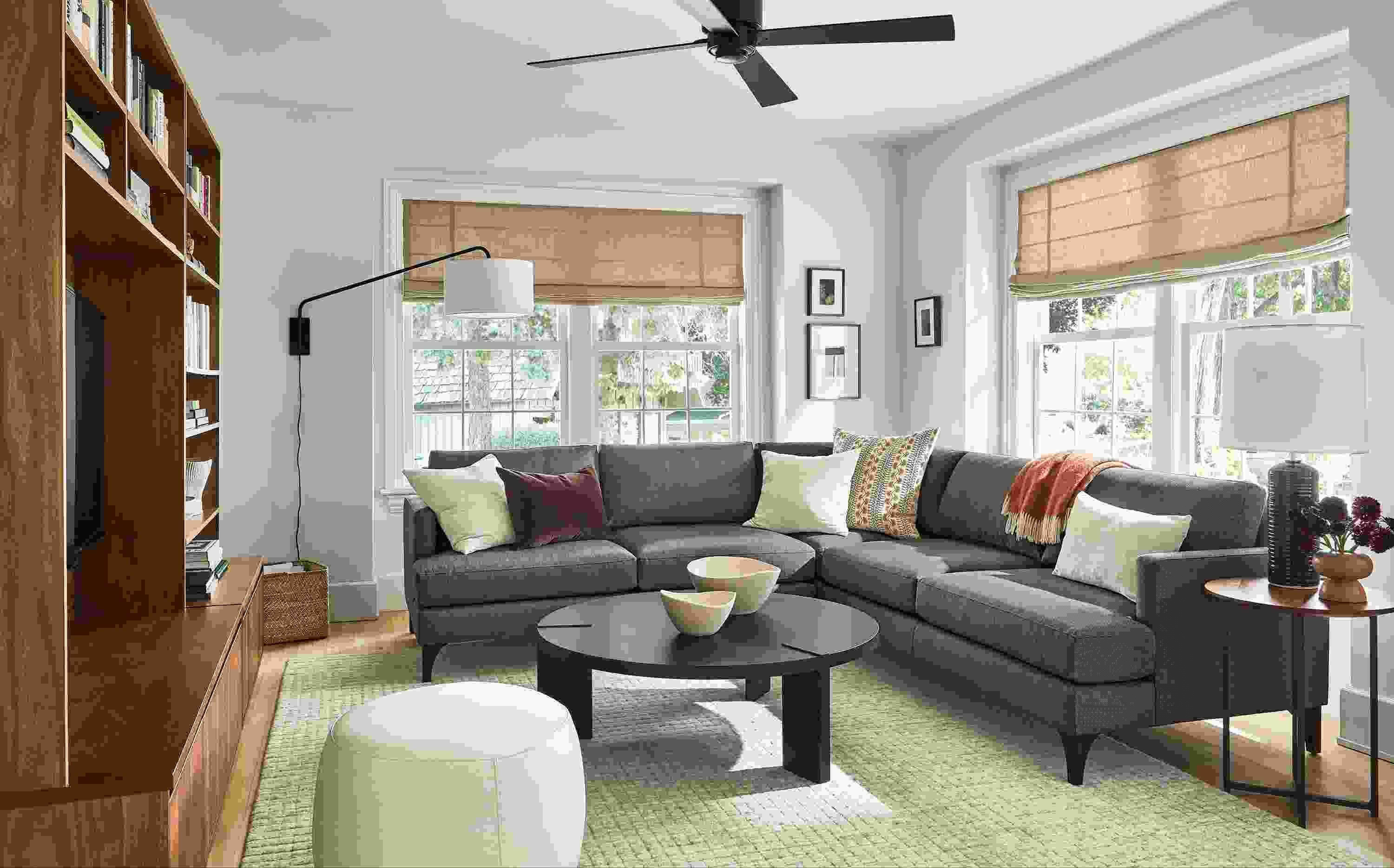 living room with carlton sectional in gino charcoal, hanover coffee table, classic end table and lind ottoman.