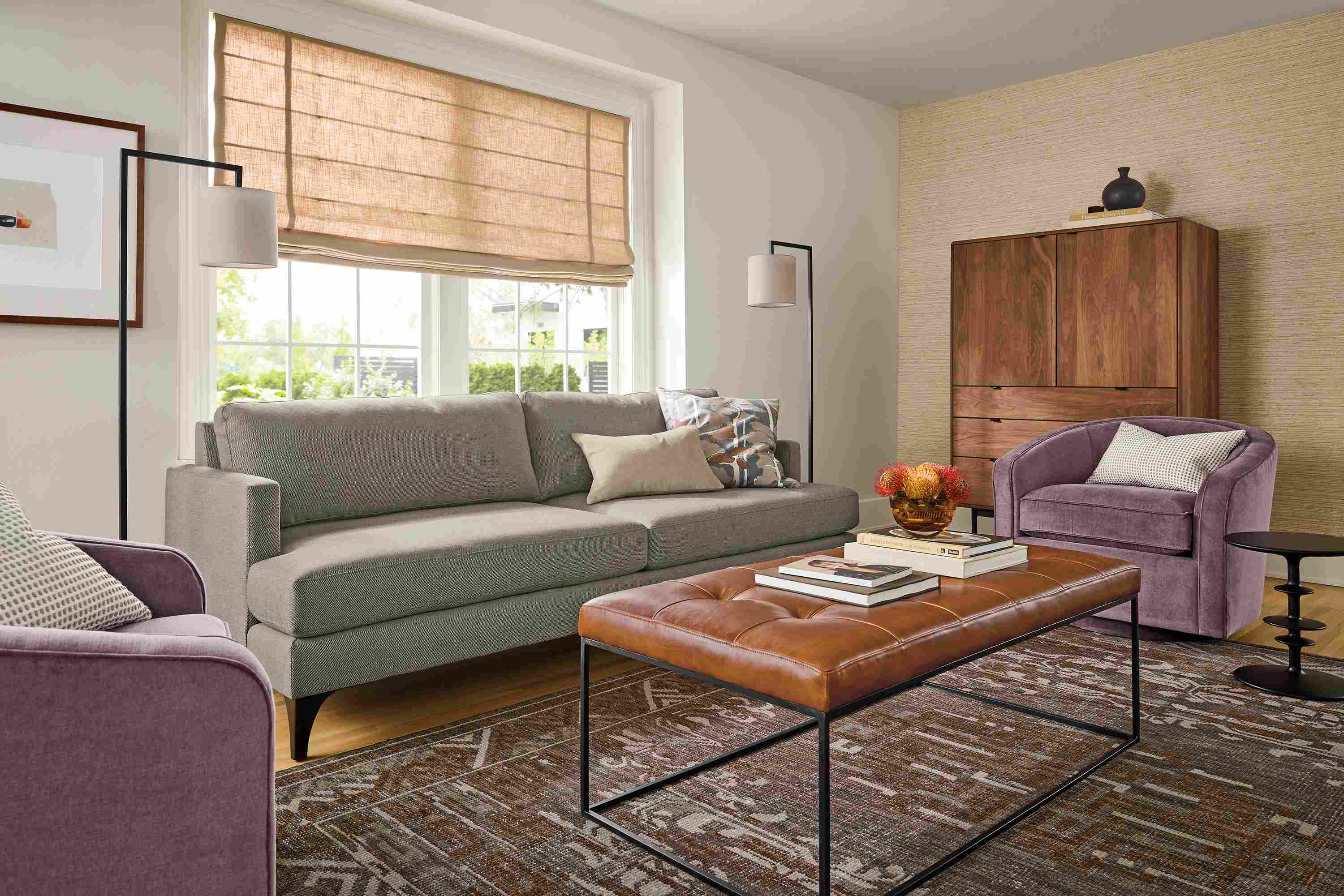 Living room with Carlton 86-wide sofa in Gino Coal, 2 Amos swivel chairs in aubergine and tyne bench in Vento Cognac.