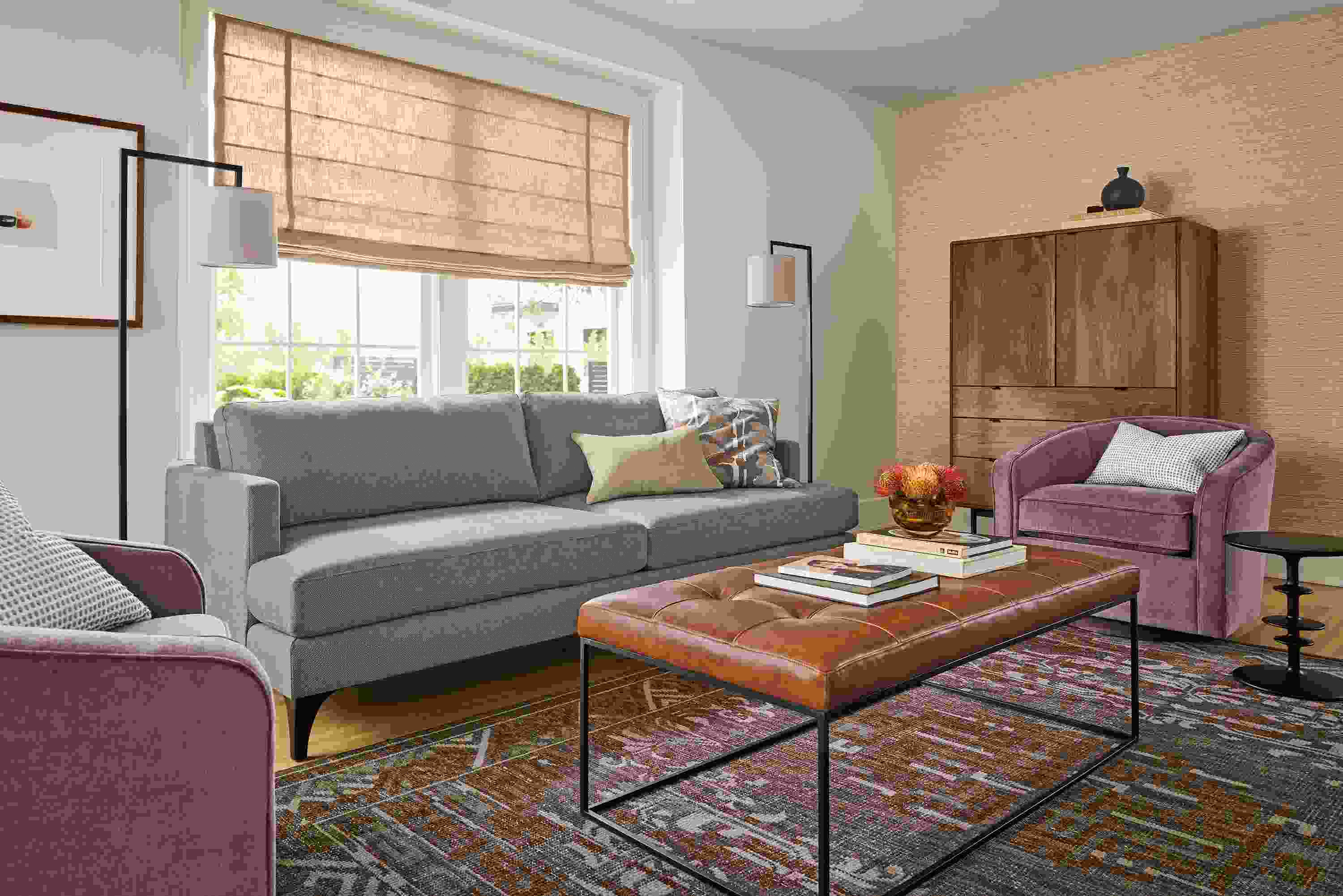Living room with Carlton 86-wide sofa in Gino Coal, 2 Amos swivel chairs in aubergine and tyne bench in Vento Cognac.