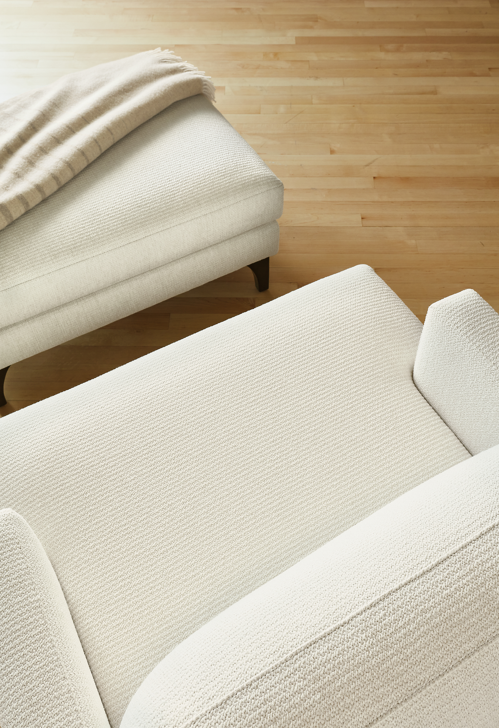 Detail of Carlton chair and ottoman in Orla White.
