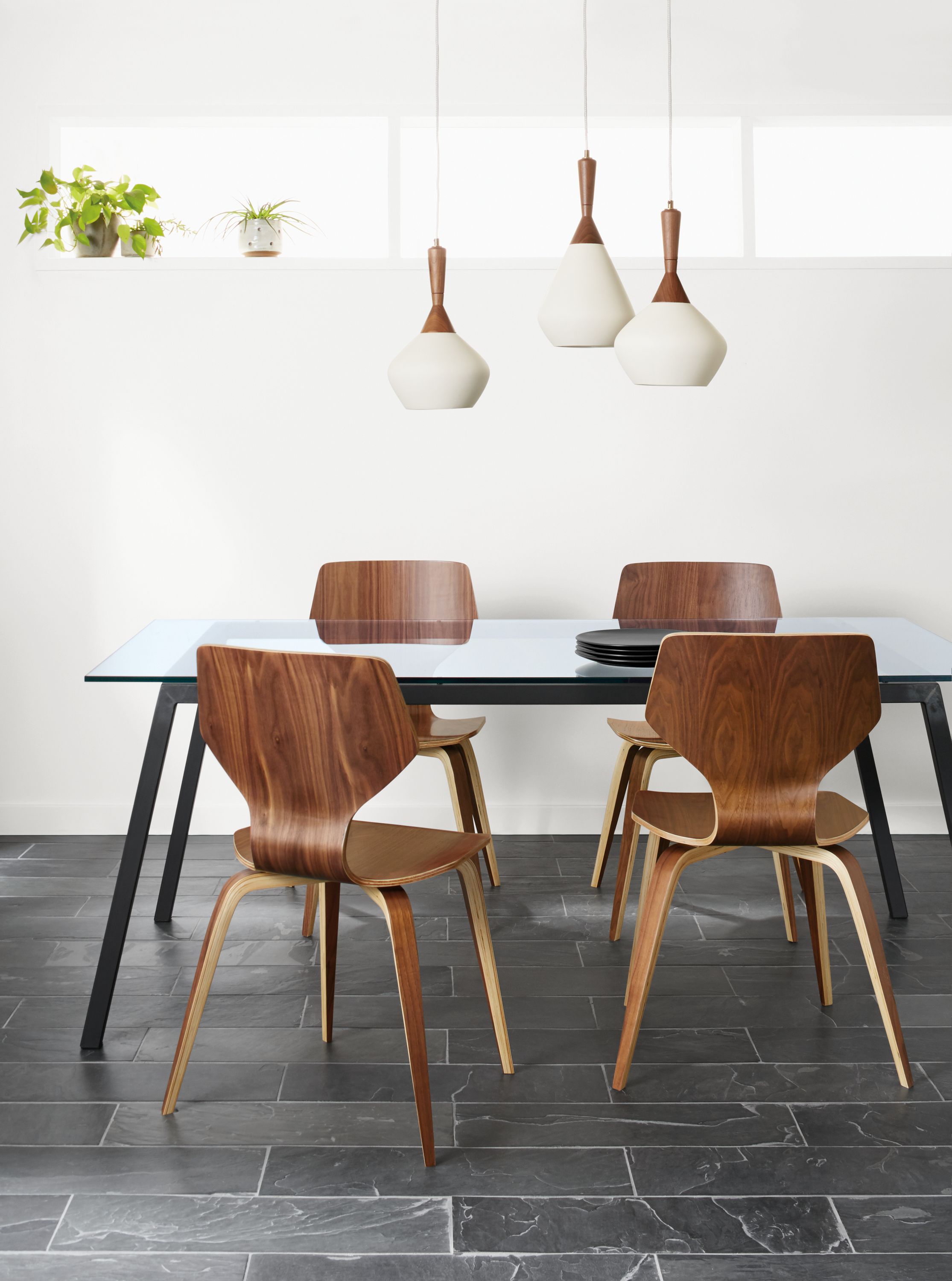 Detail of Cass dining table with glass table top.