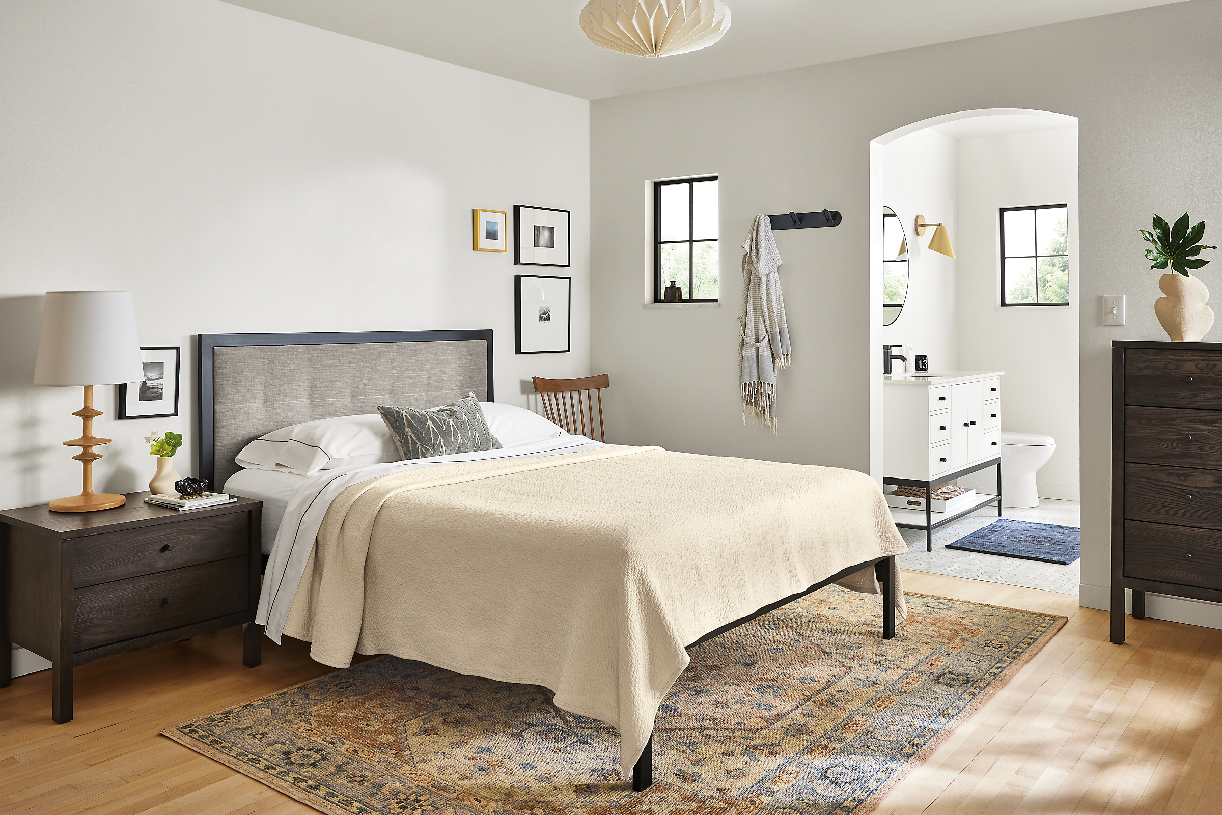 Bedroom with chapman queen bed, emerson nightstand, veda rug; bathroom with linear vanity.