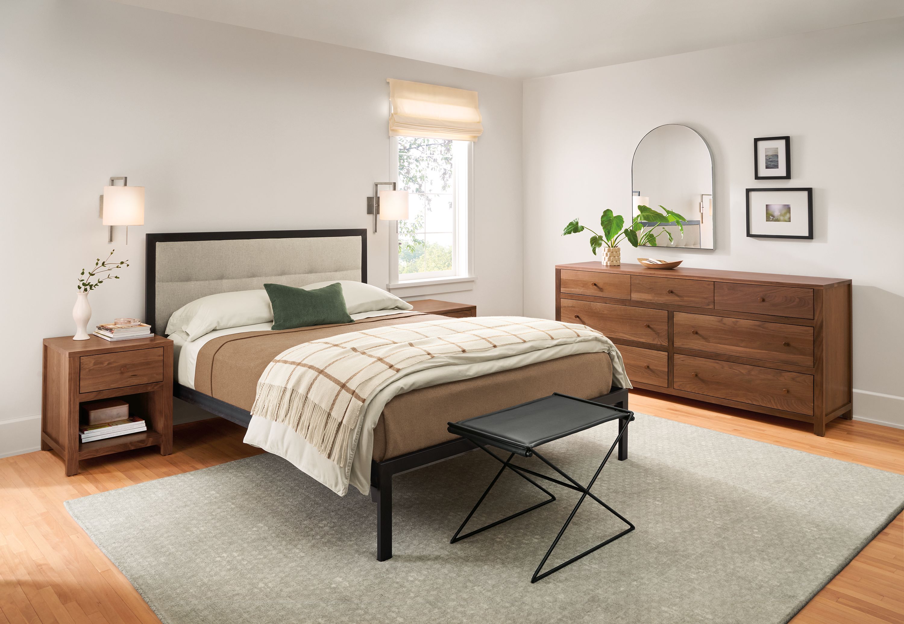 bedroom with chapman bed, corwin walnut dresser and nightstands, lantern sconces.