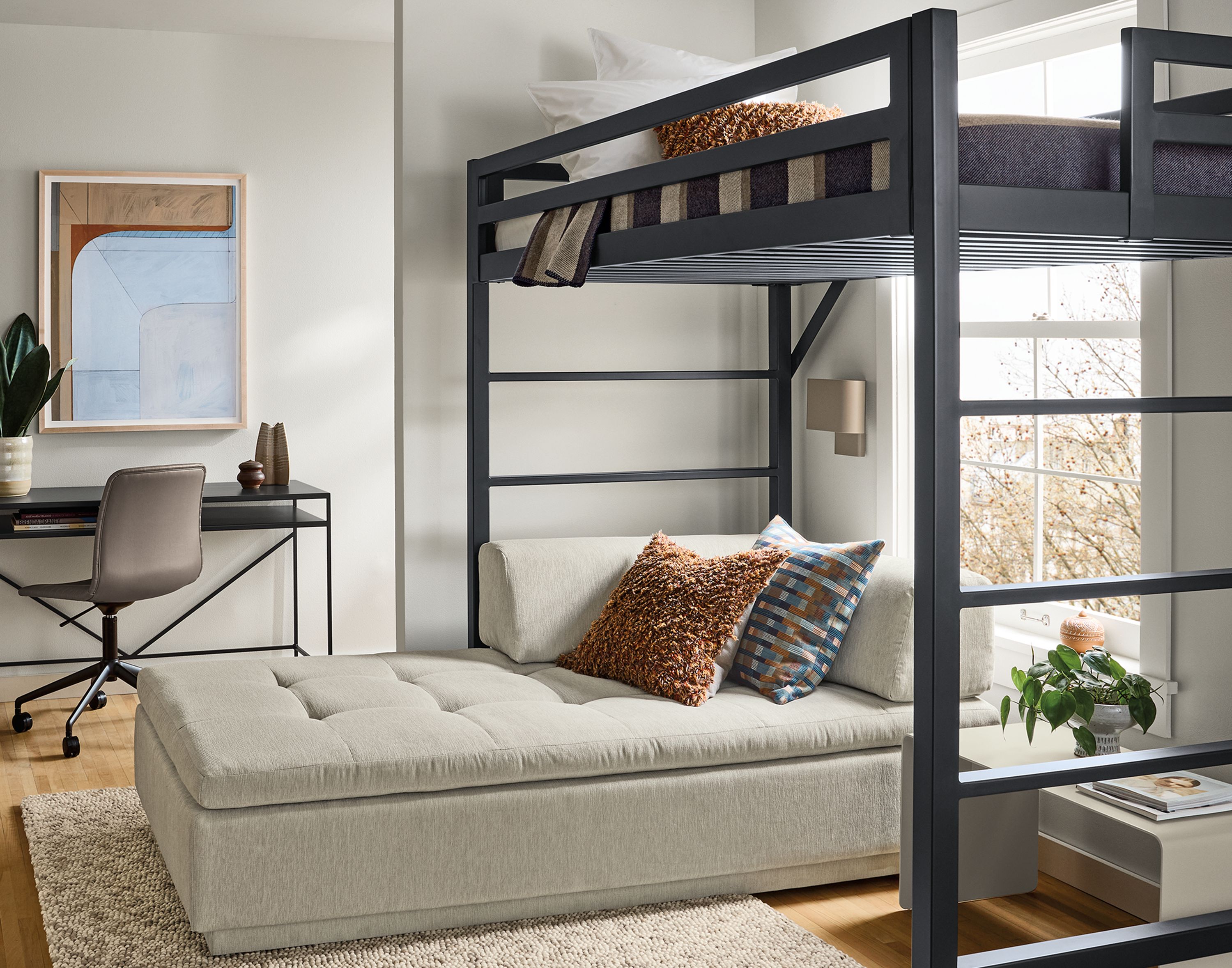 Room with a Chase twin loft bed and slim desk in natural steel, Cato office chair in Sarno Putty leather and Hastings rug in ivory/taupe.