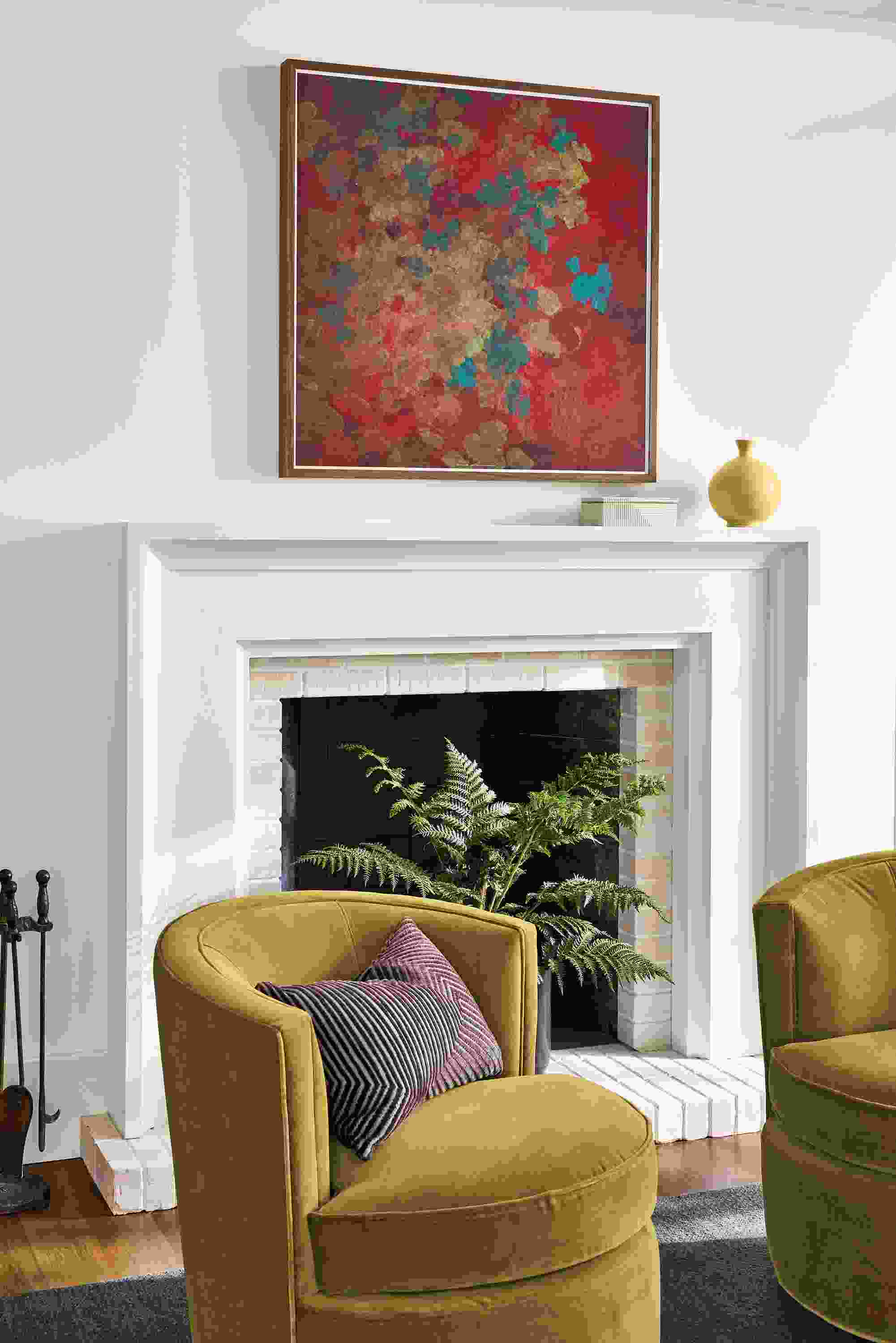 Living room with wall art from Cedric Chauvelot untitled 2009-06, Sienna over a fireplace.