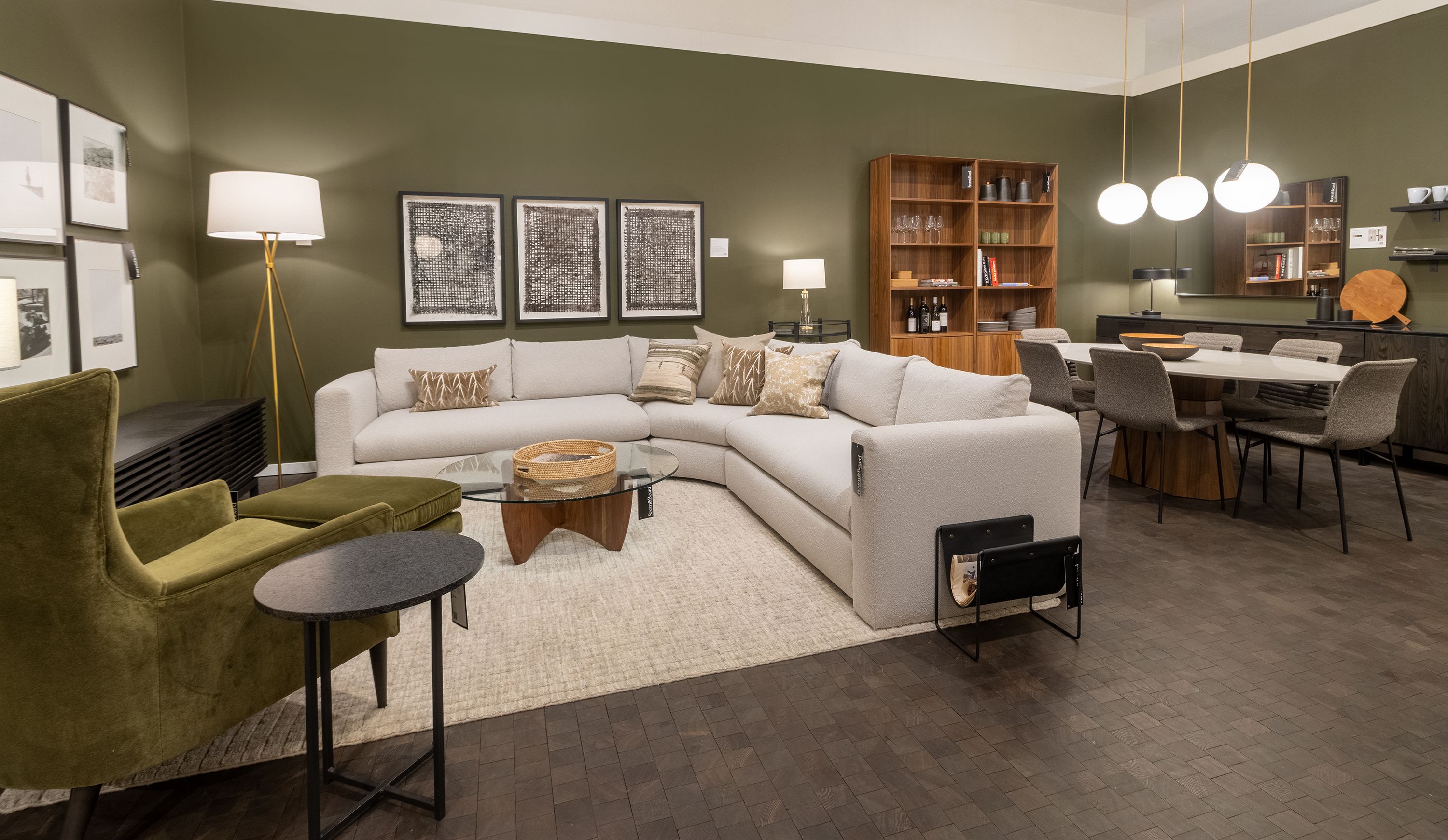 Store photo with a Hannah 124 by 124 sectional in Declan Natural and a Bradford chair and ottoman in Redding Olive.