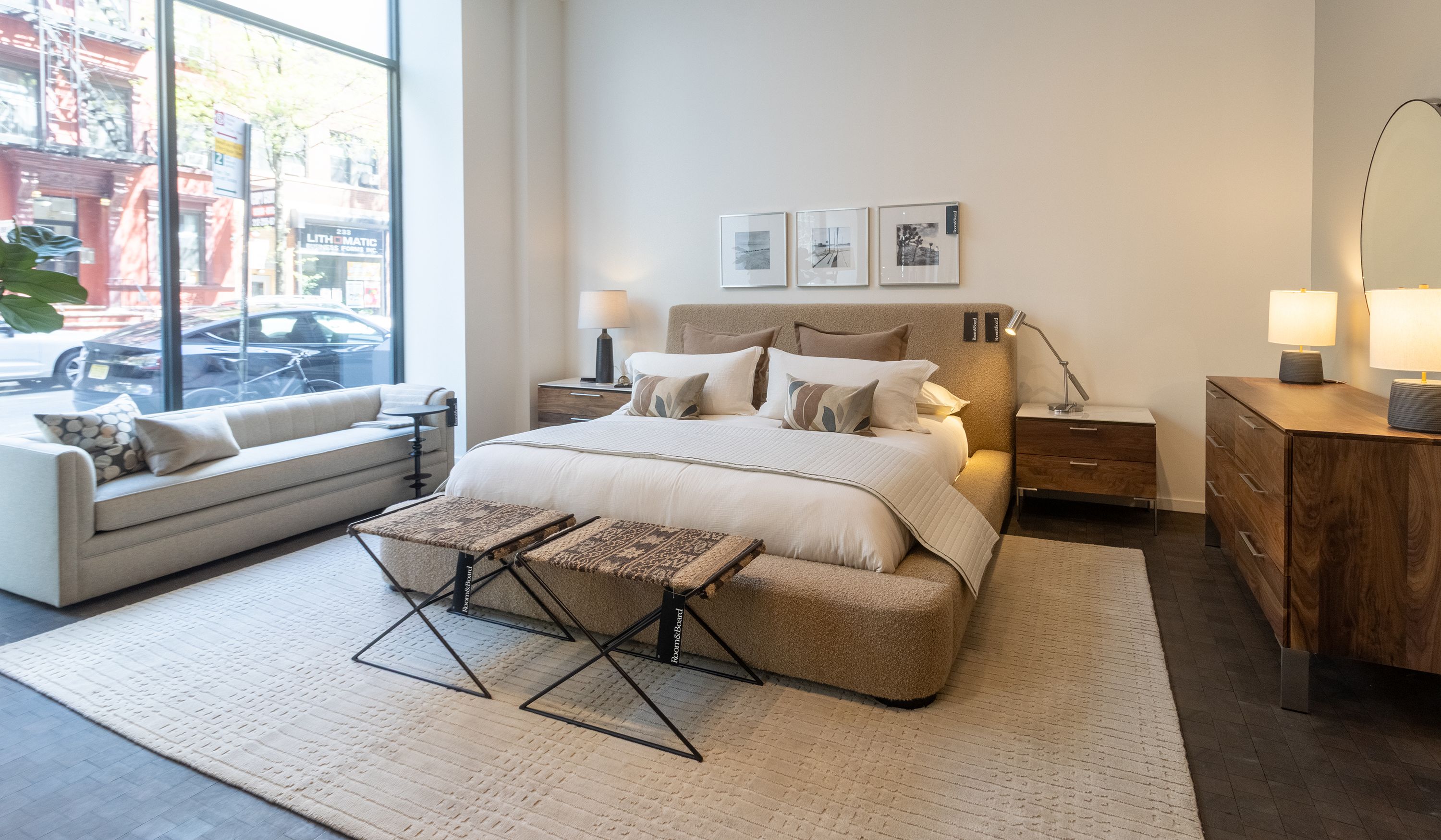 Store image with Kai king bed in Dornick Camel and Kenwood nightstands and dresser all in walnut.