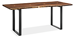 Angled view of Chilton 72-wide Walnut Dining Table with Natural Steel Base.