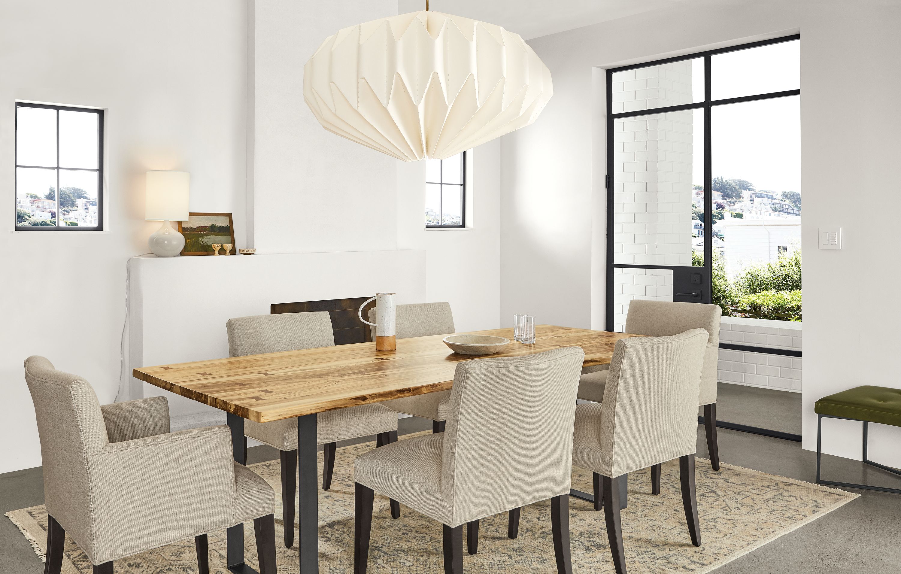 Detail of Chilton table in spalted sugarberry with natural steel base with Anjora rug.