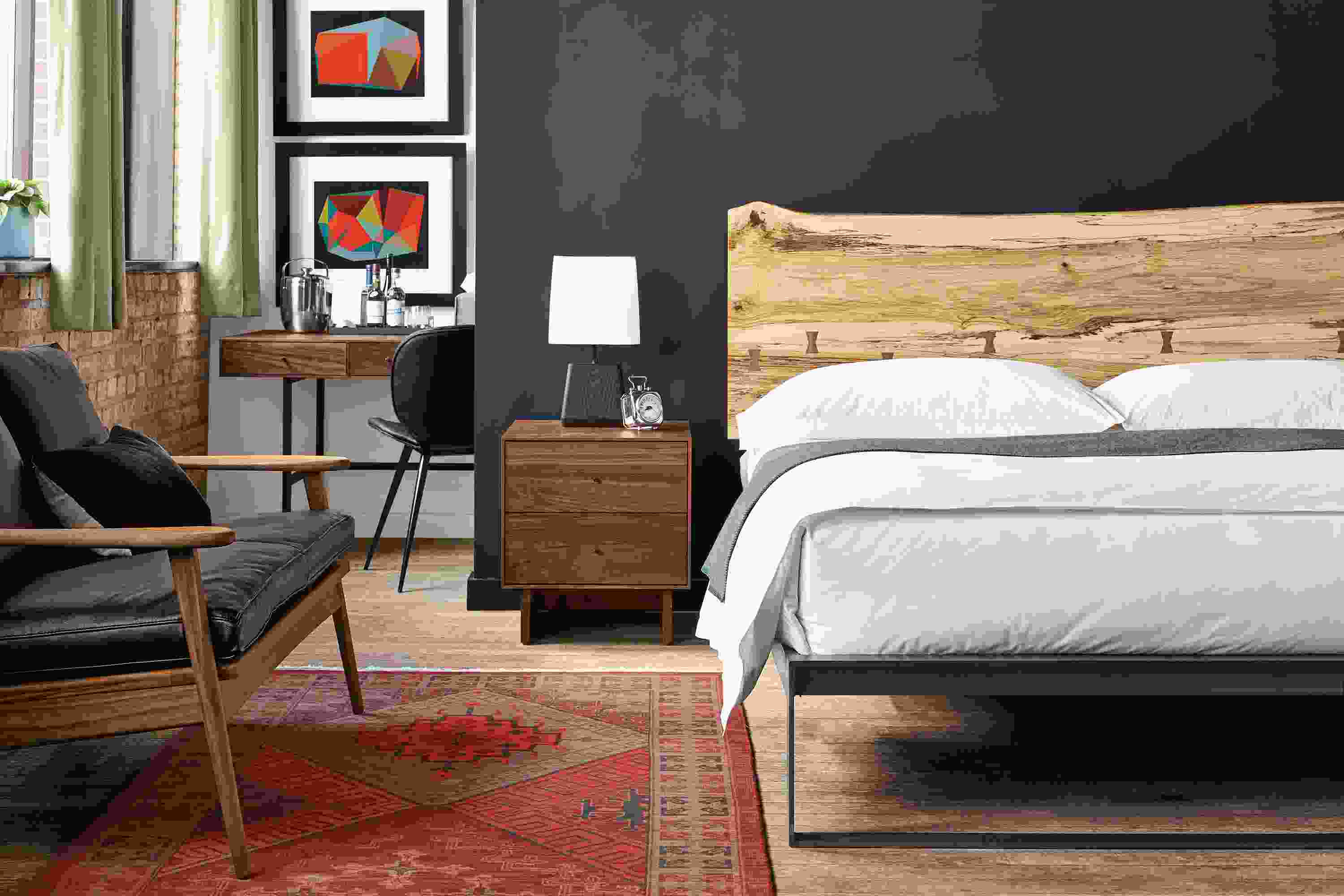 Detail of Chilton king bed in spalted sugarberry in bedroom setting.