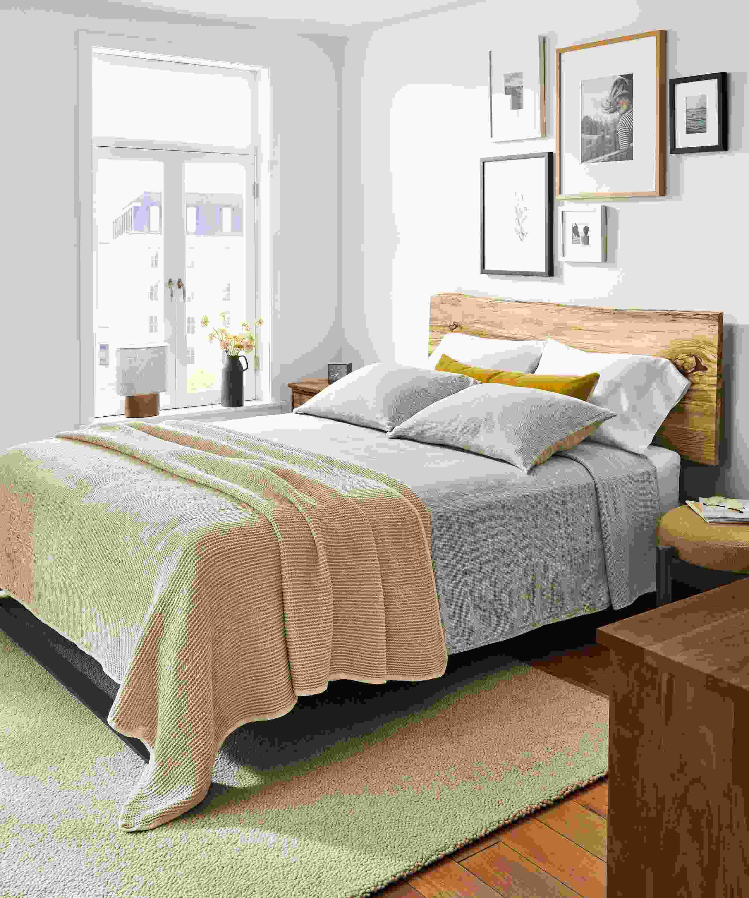 Bedroom with Chilton queen bed in Spalted sugarberry, Emma coverlet, loren coverlet and relaxed linen bedding.