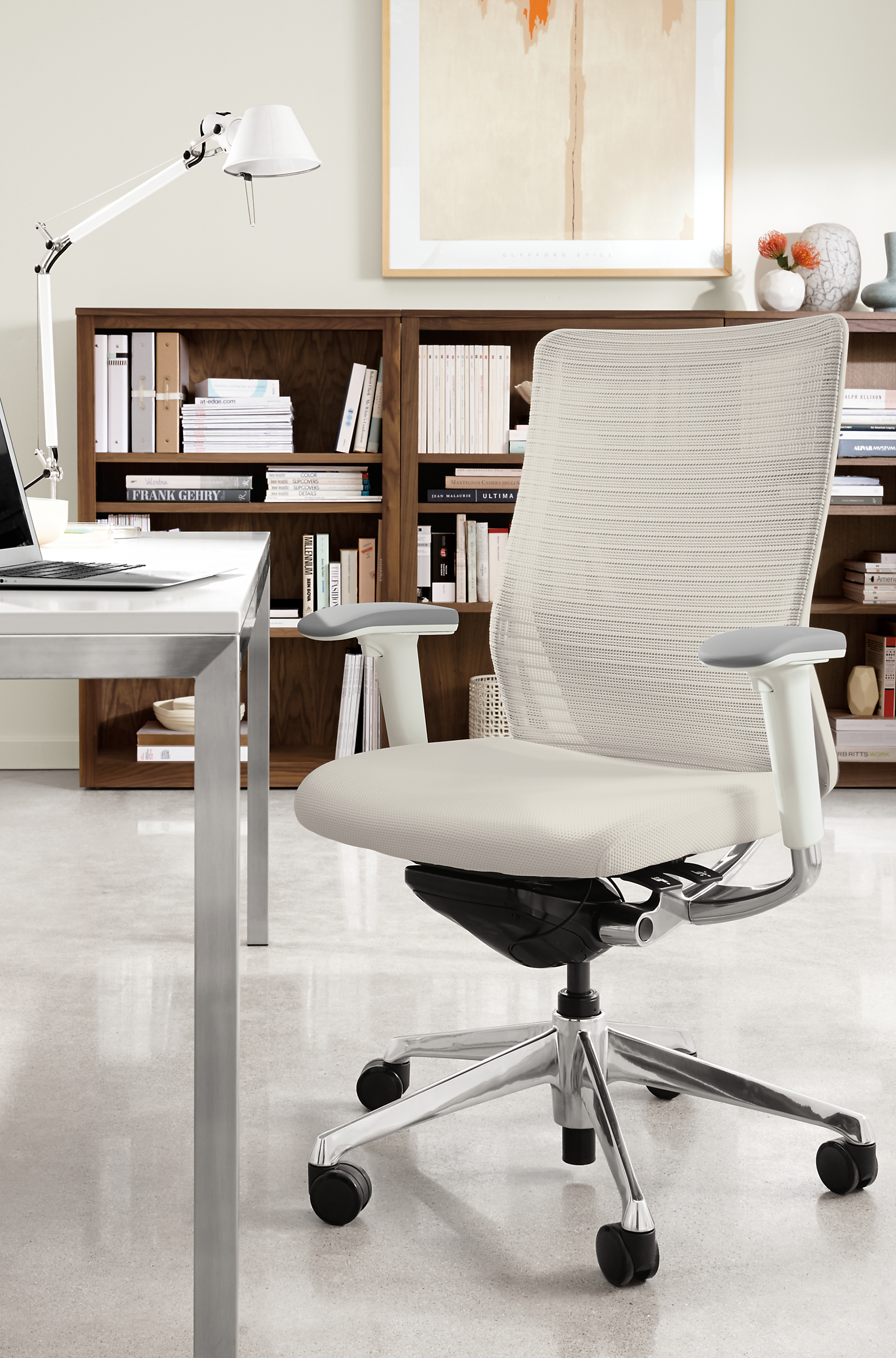 Office with Choral office chair in polished aluminum with white mesh.