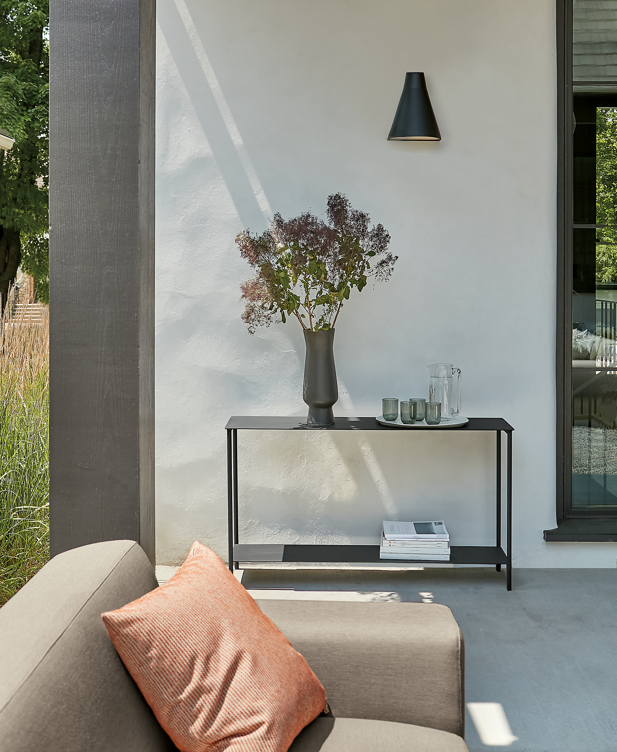 outdoor space with circuit outdoor console table and drift sofa.