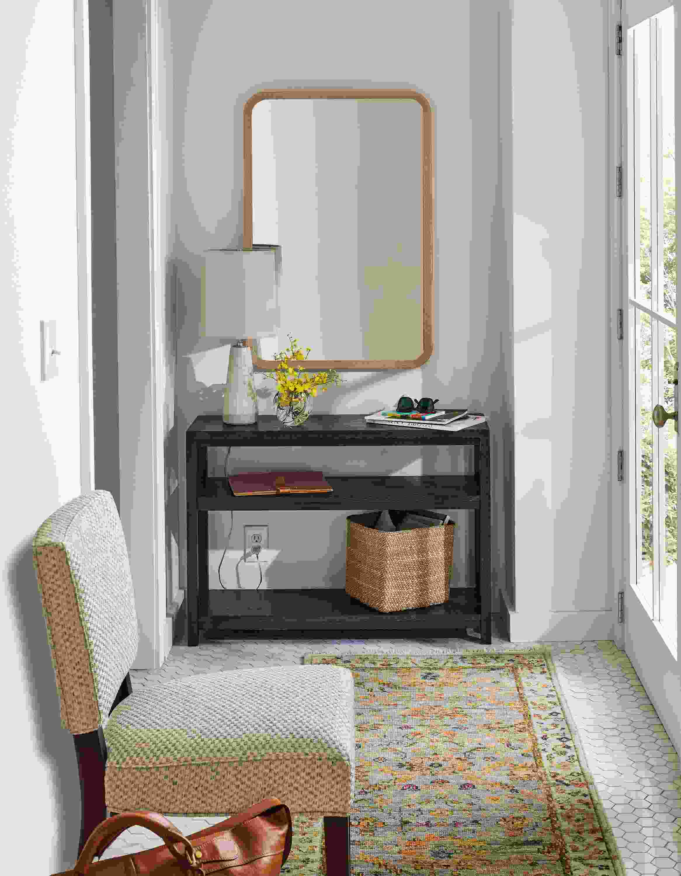 Entryway with clark 38-wide console table in charcoal, georgia side chair in lang grey and sundar rug in sky.