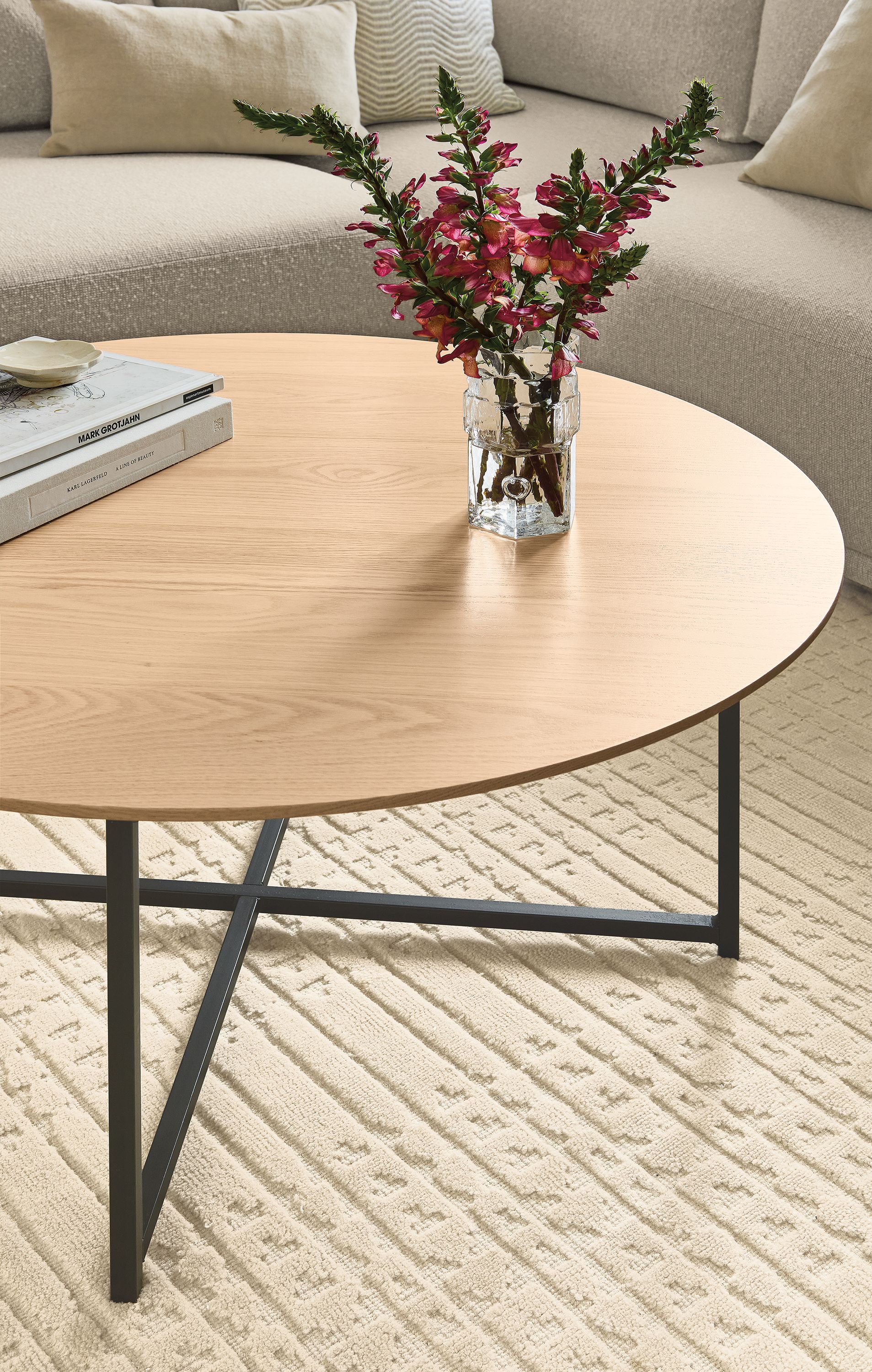 Living room with Classic 36-diameter coffee table in natural steel and salt on rye and Bria rug in Ivory.