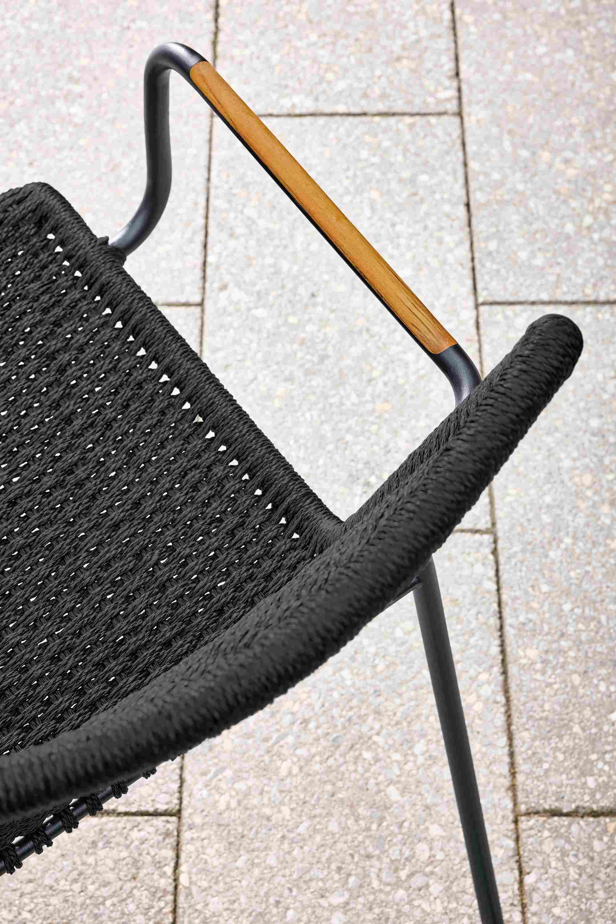 Detail of Clea outdoor arm chair in black with black cording.
