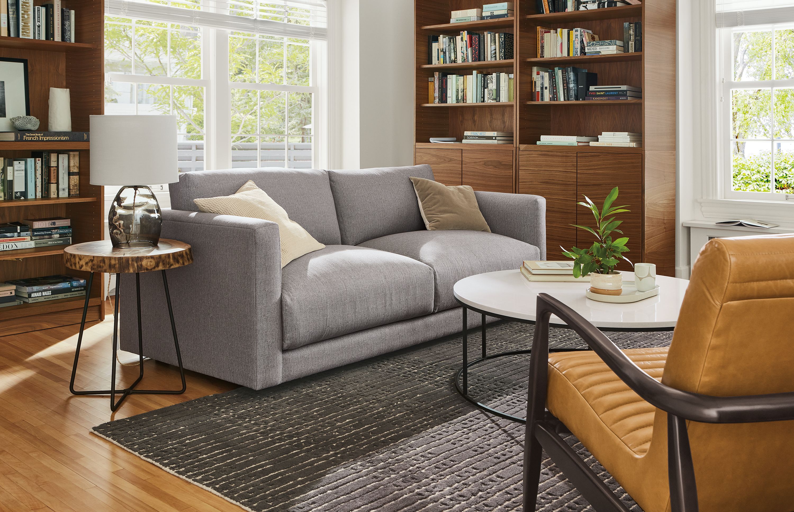 living room with clemens sofa in hines fabric, bria rug, callan chair.