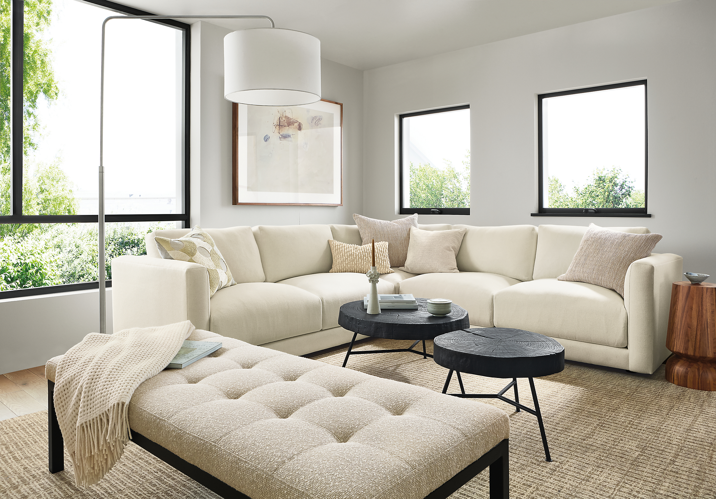 living room with clemens sectional, ravella bench, rayne floor lamp.