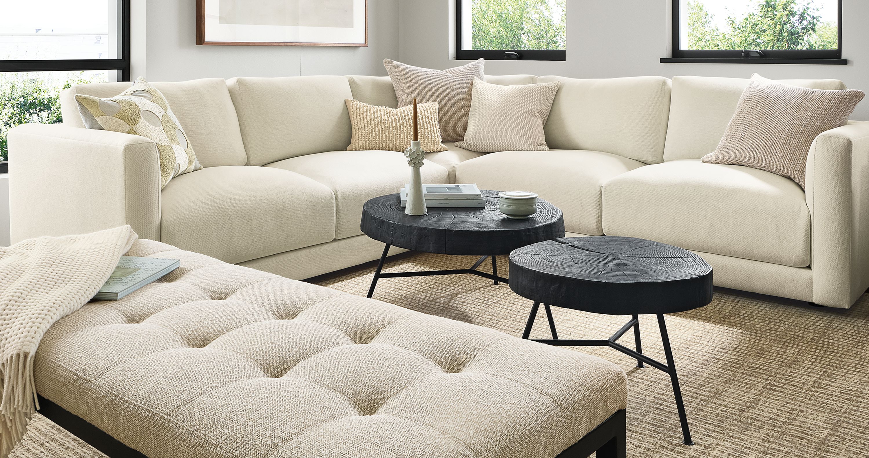 living room with clemens sectional, ravella bench, rayne floor lamp.