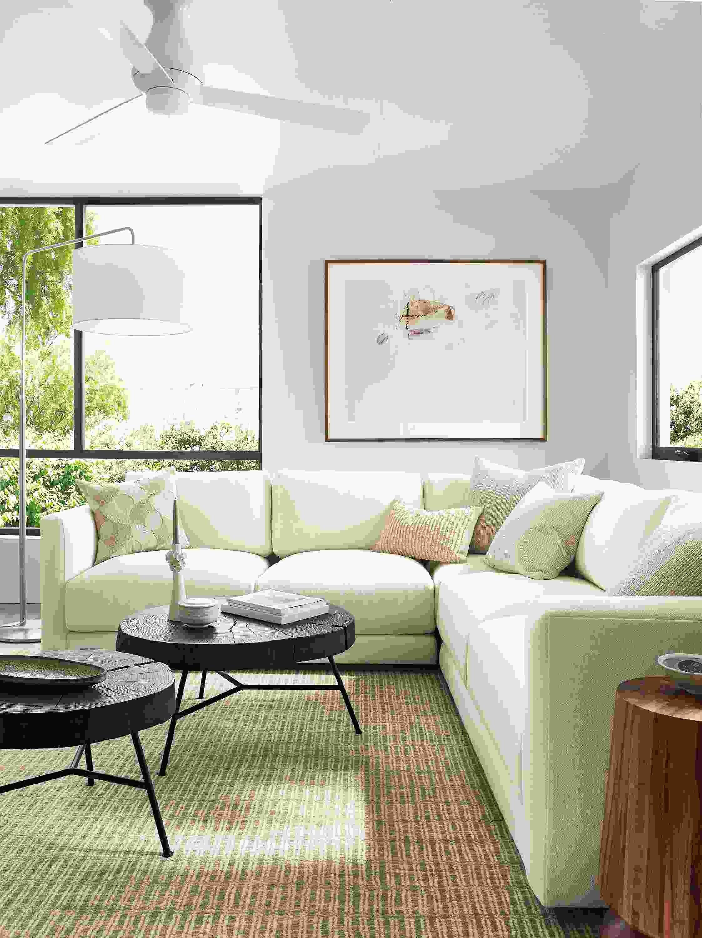 living room with clemens sectional, two prospect coffee tables, nera rug.