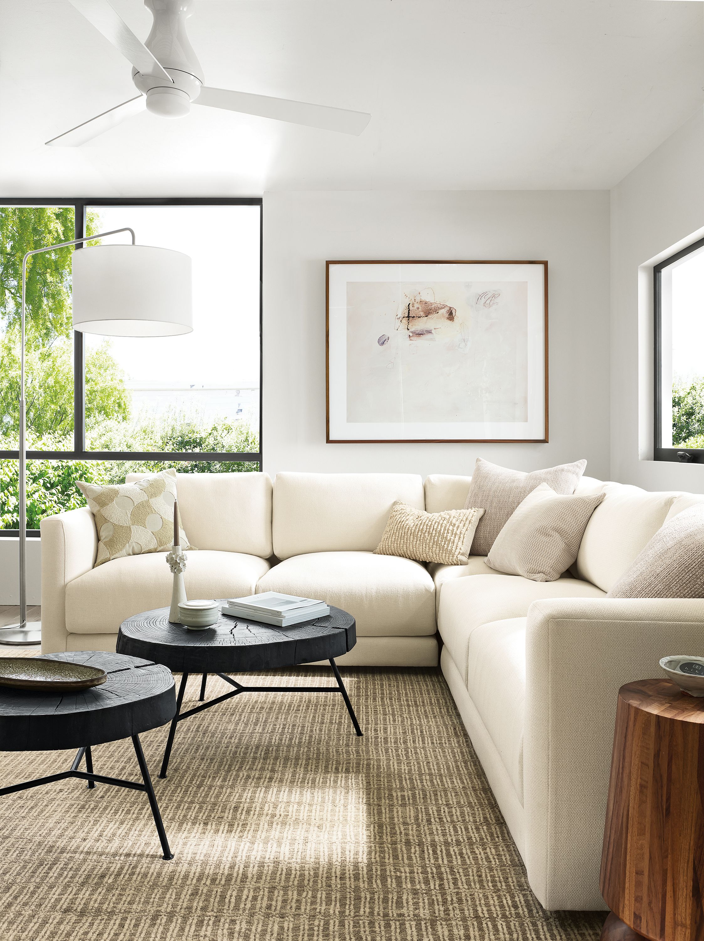 living room with clemens sectional, two prospect coffee tables, nera rug.