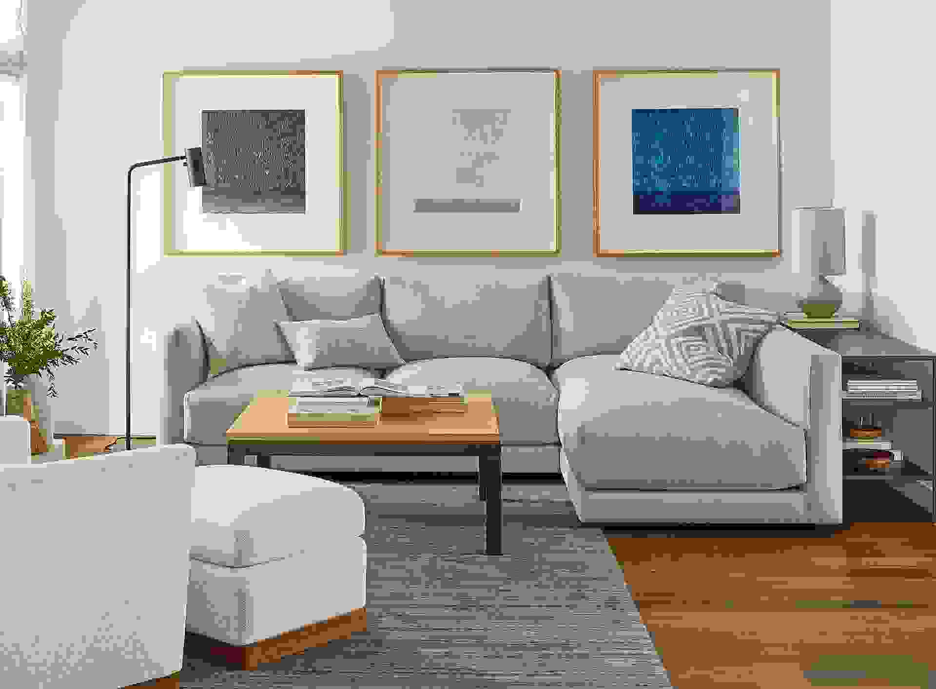 Detail of Clemens sofa in Flint oatmeal fabric in living room with Ayomi Yoshida wall art.