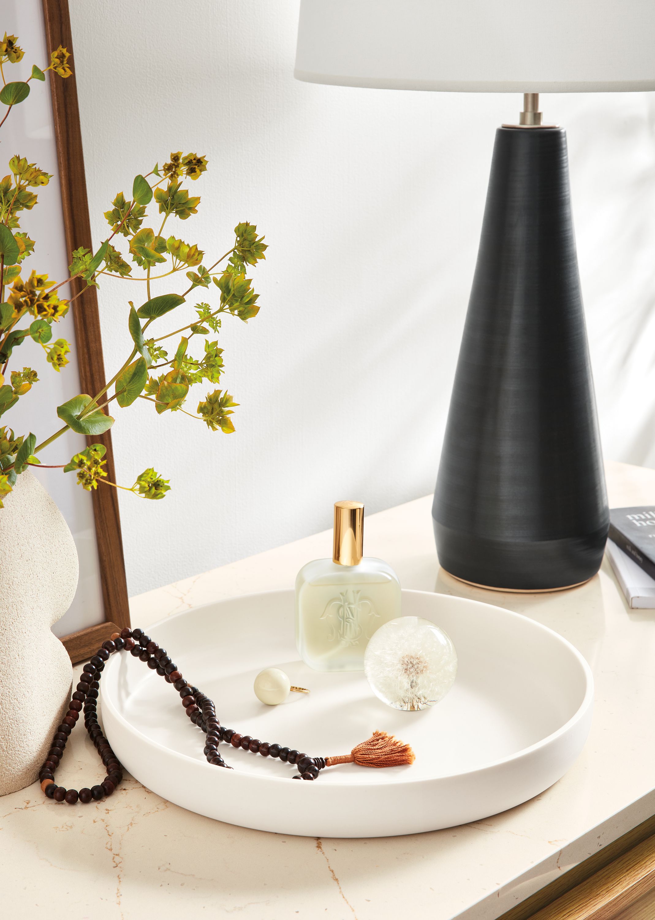 Detail of Cleo bowl in ivory on ecru quartz cabinet top.