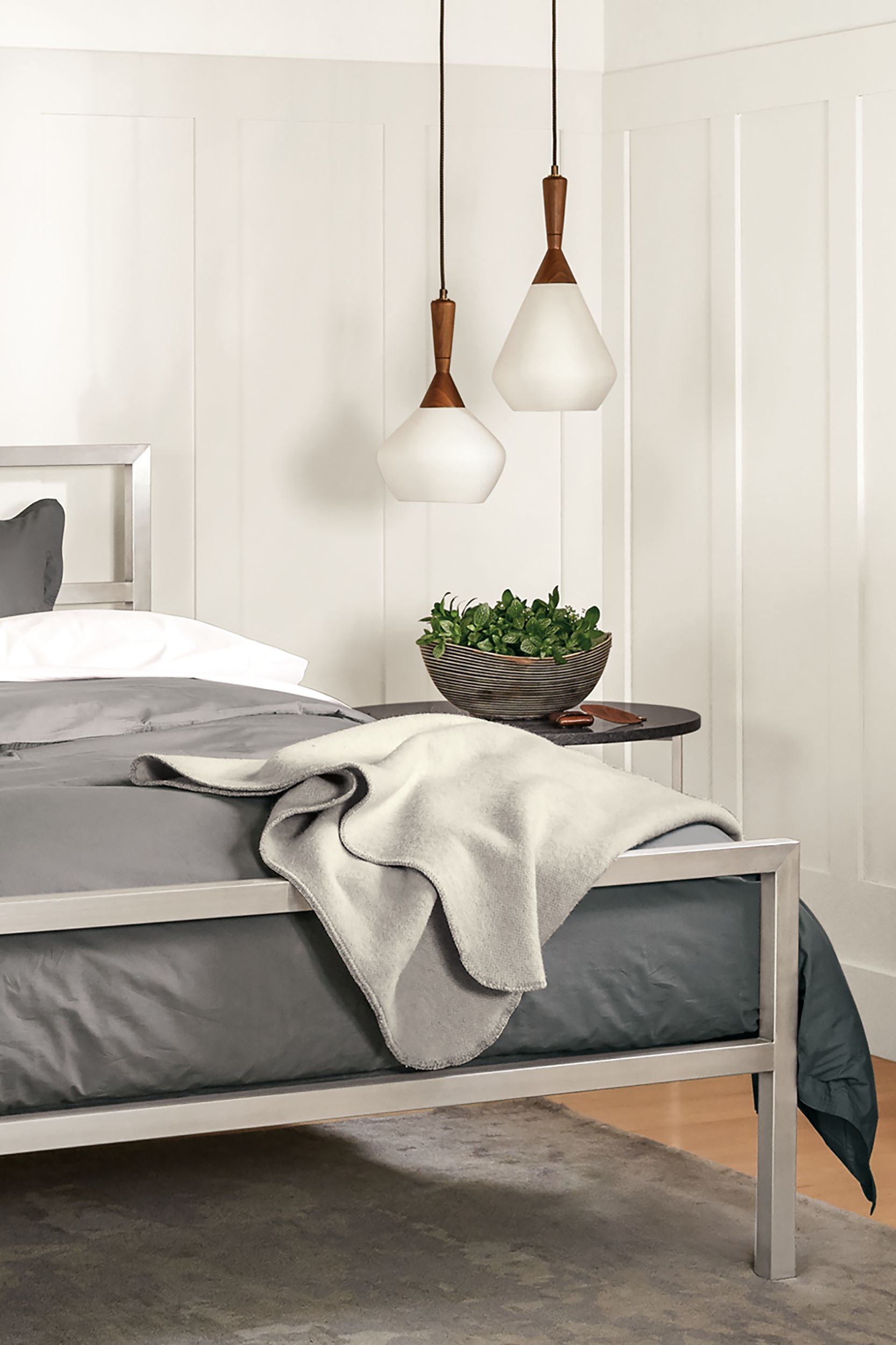 Detail of Parsons stainless steel queen bed in all stainless steel.