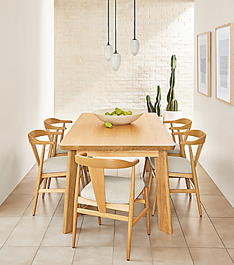 Minimalist dining room with Colby table, Evan chairs and Polar pendants.